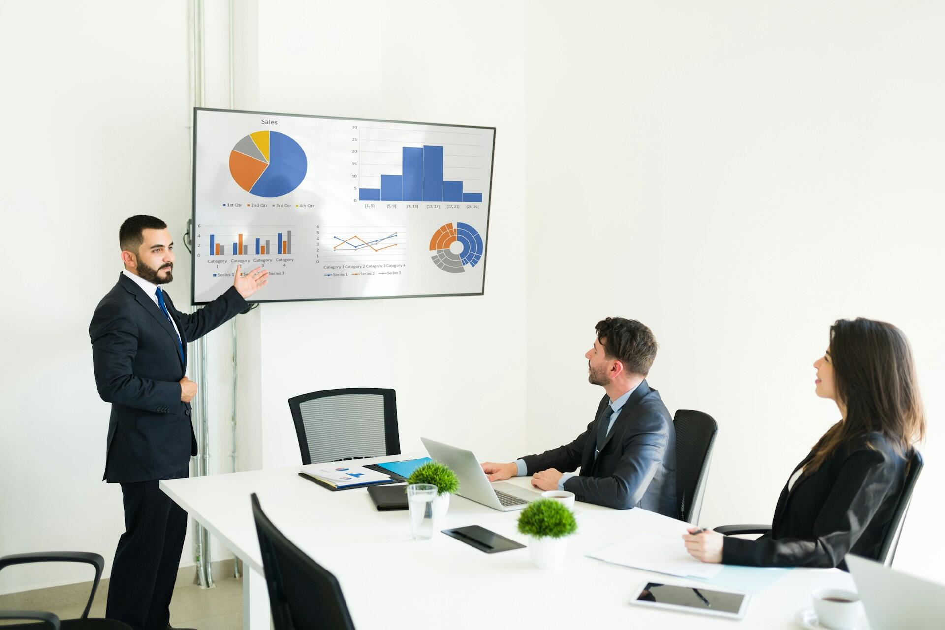 man giving a business presentation with finance information