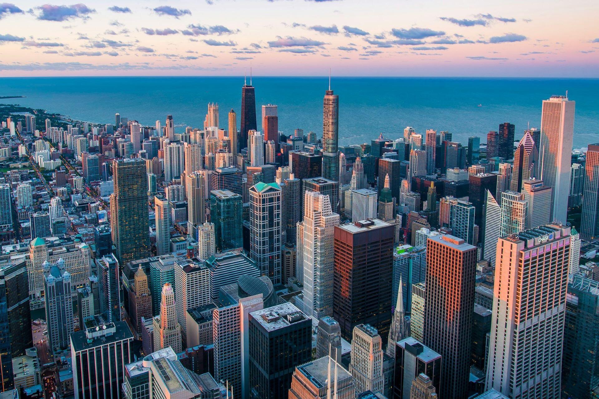 Chicago skyline at sunset with high-rise buildings along Lake Michigan