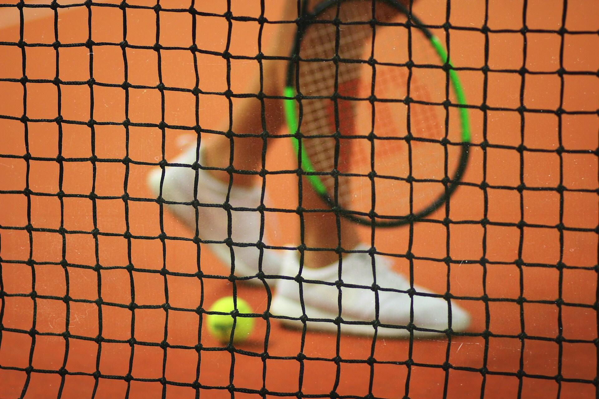 A tennis player on a clay court.