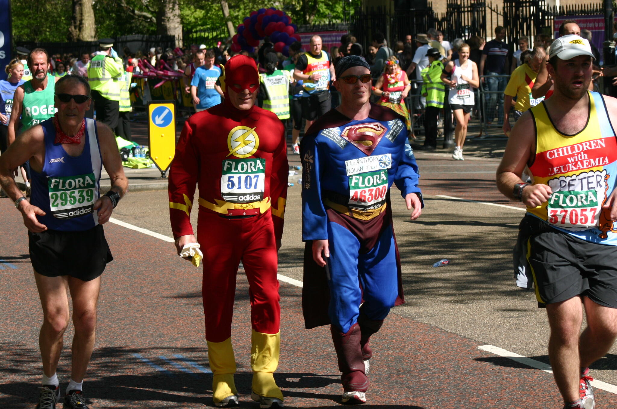 marathoners wearing superhero costumes