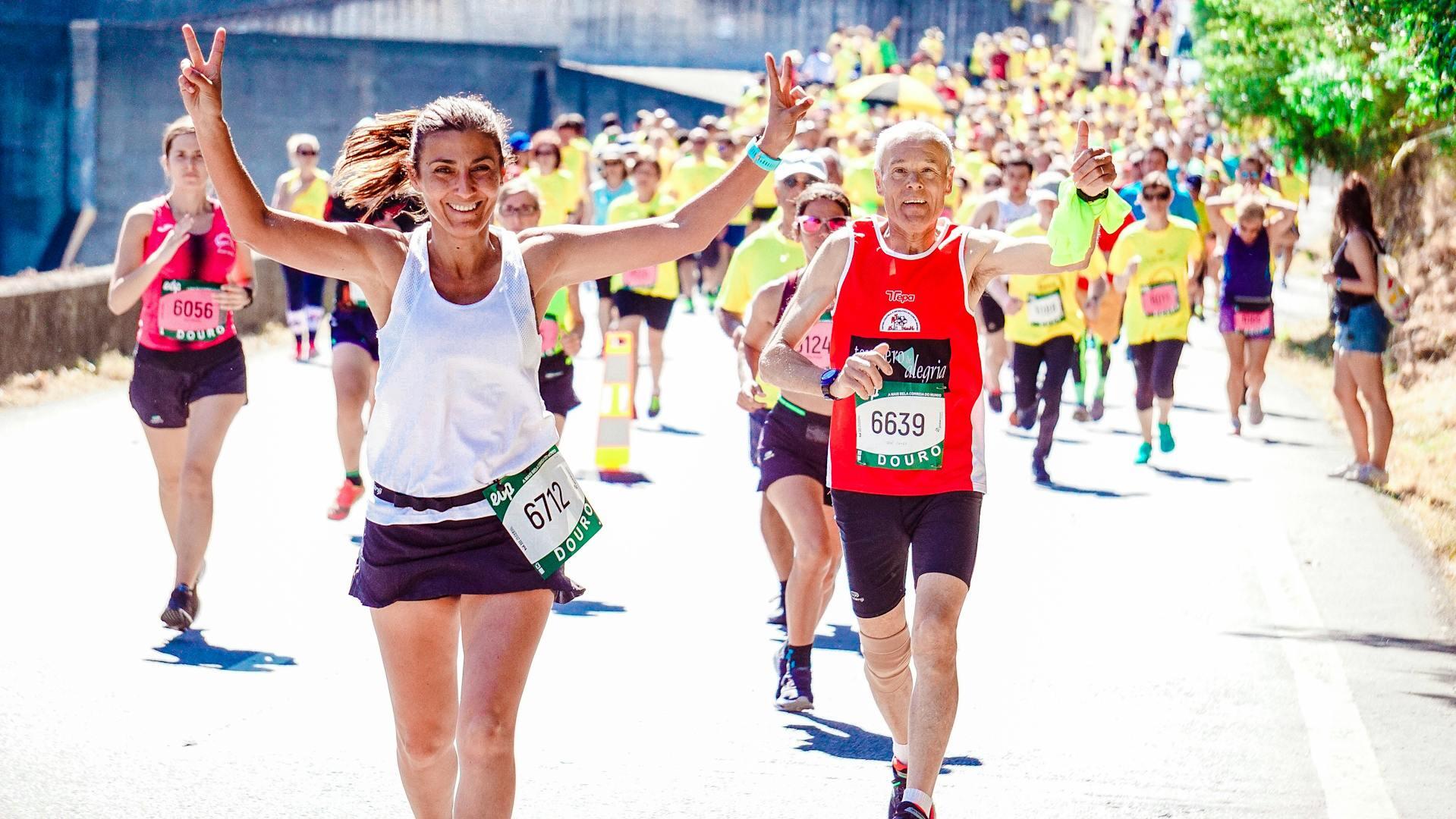 Runners competing in a marathon and smiling