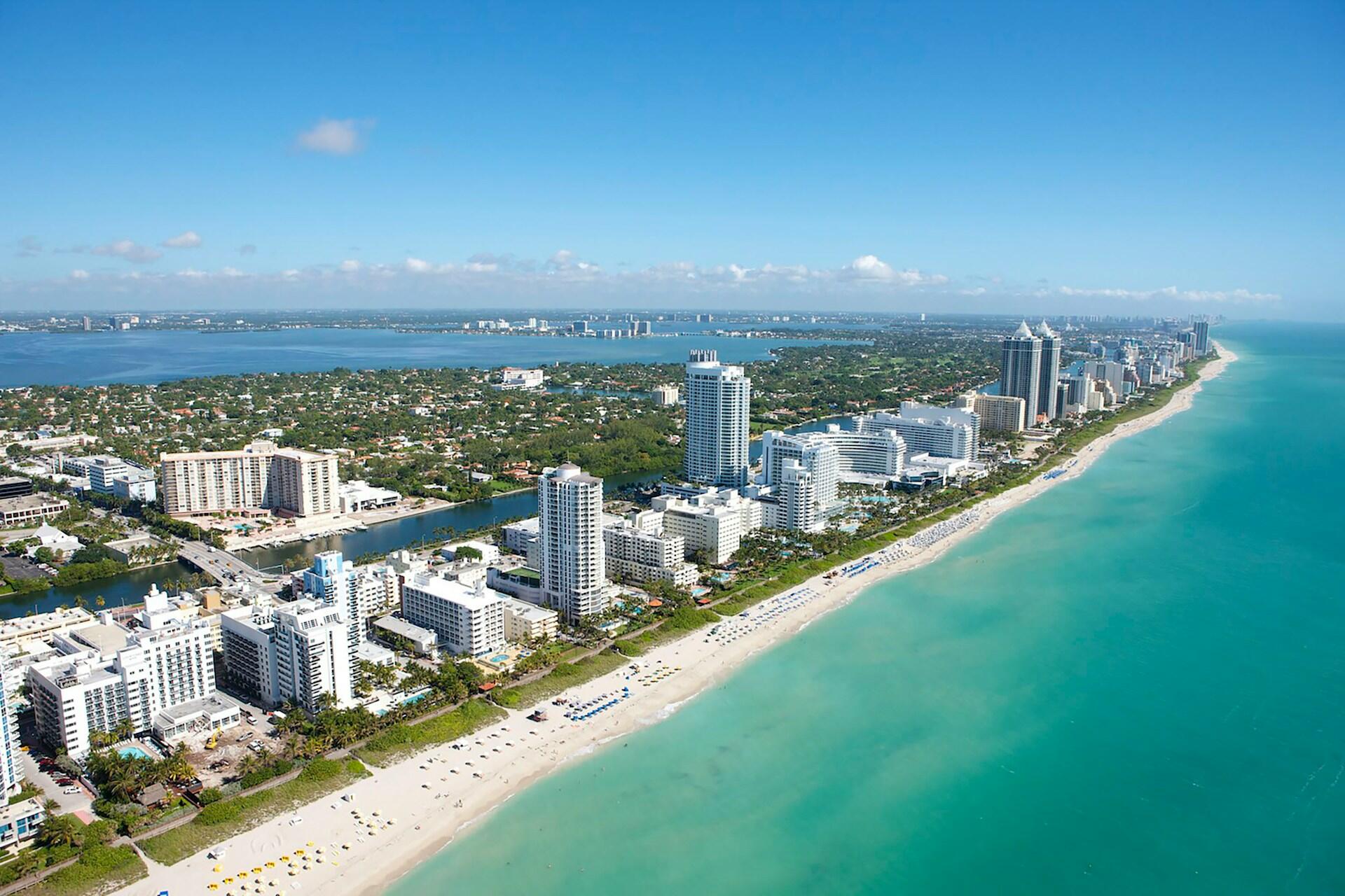 Aerial view of Miami Beach coastline with hotels, beach, and ocean
