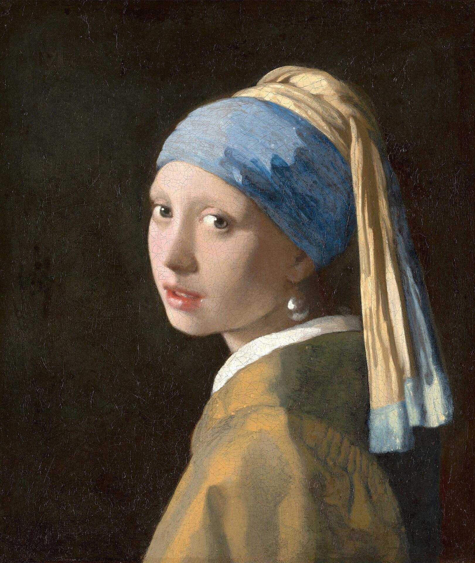 A girl wearing a blue headband and a large pearl earring looks over her shoulder. 