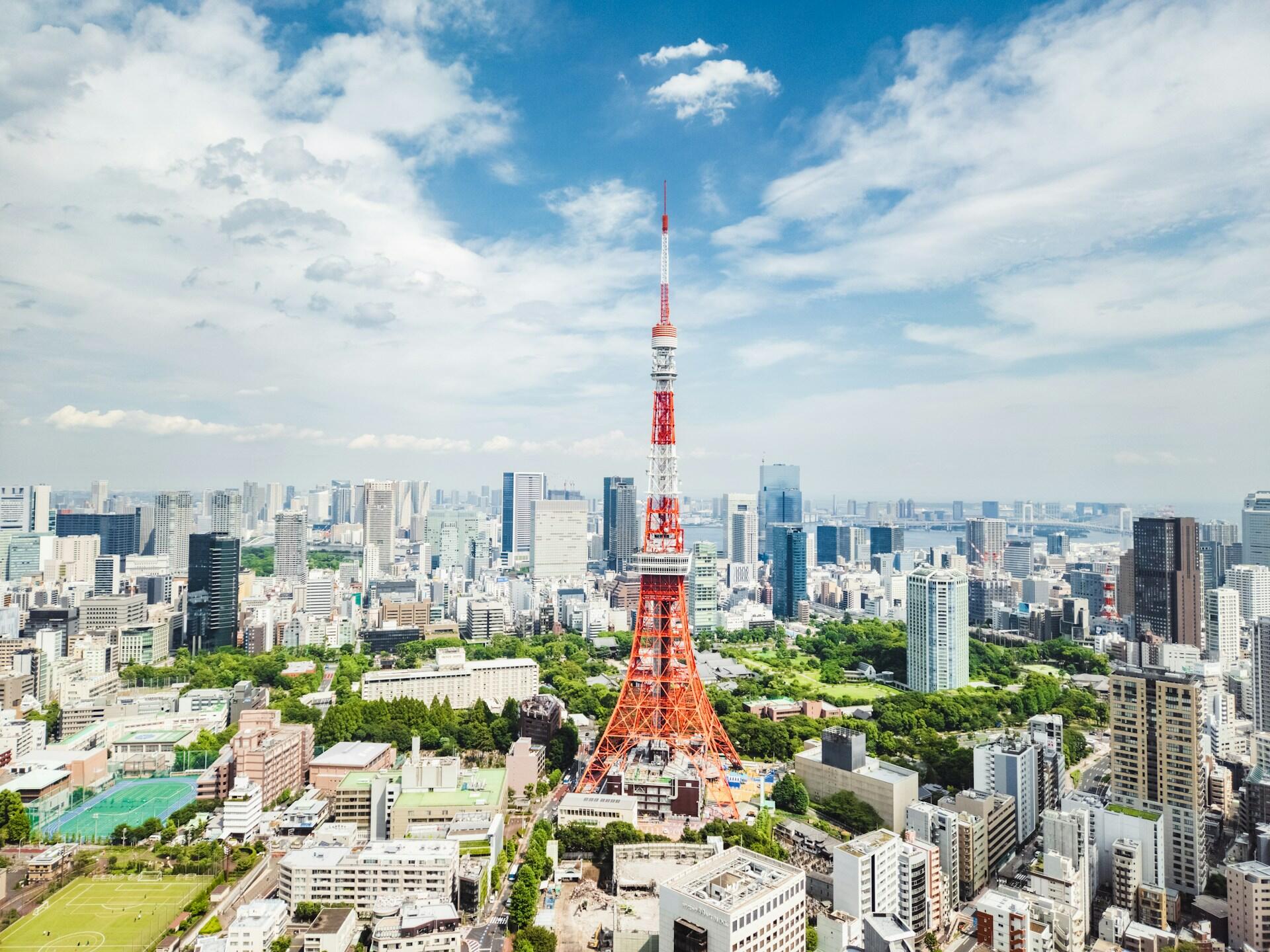 Tokyo Tower mixed among the city buildings and green parks
