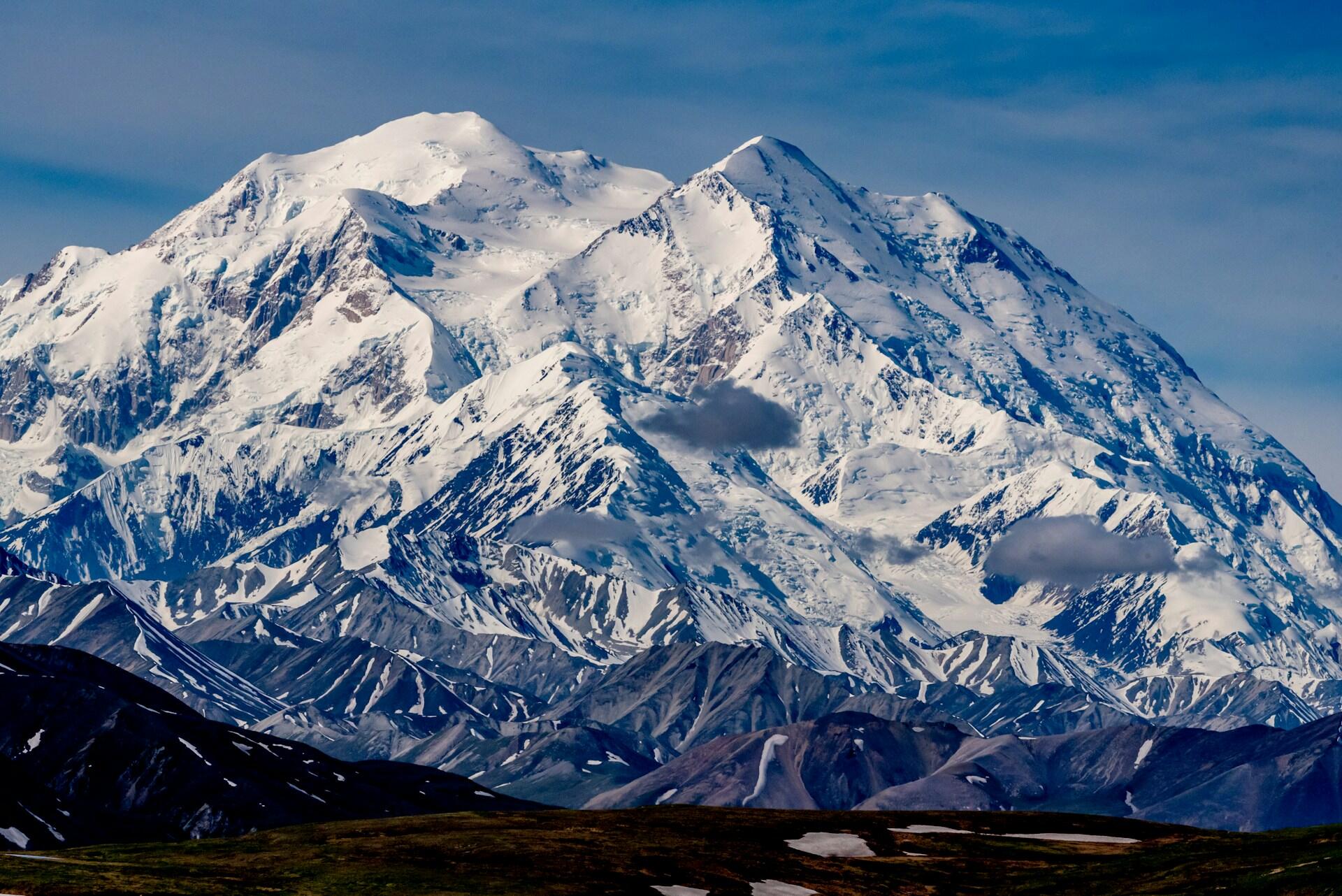 Denali on a clear day, covered in snow and appearing massive
