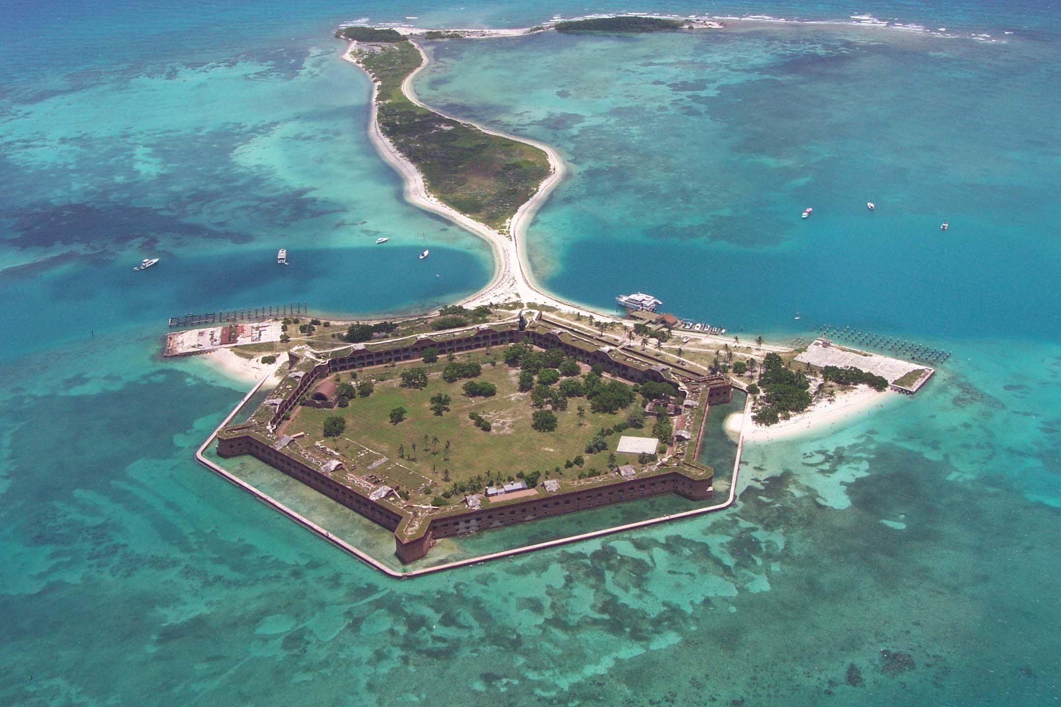 aerial view of Fort Jefferson with white sand beaches surrounding it