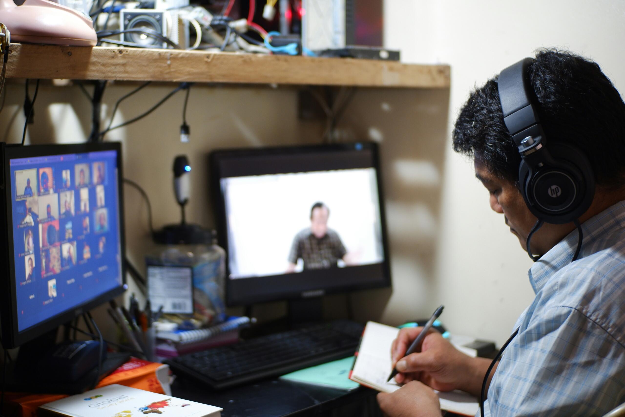 ASL interpreter working via a video remote interpreting (VRI) setup