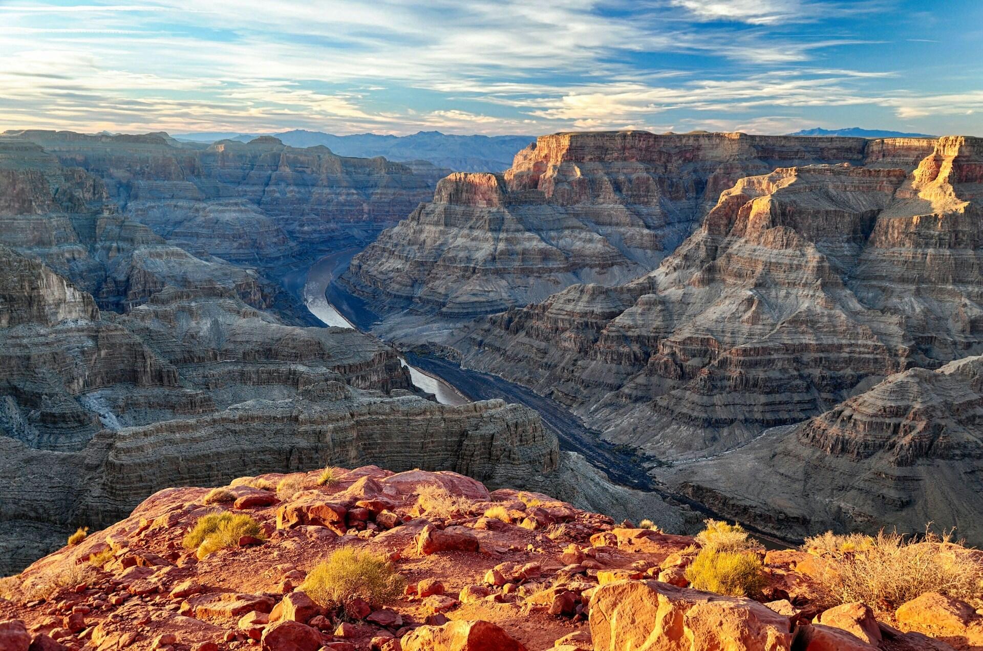 grand canyon at sunrise, with the deeper parts of the canyon in shadow