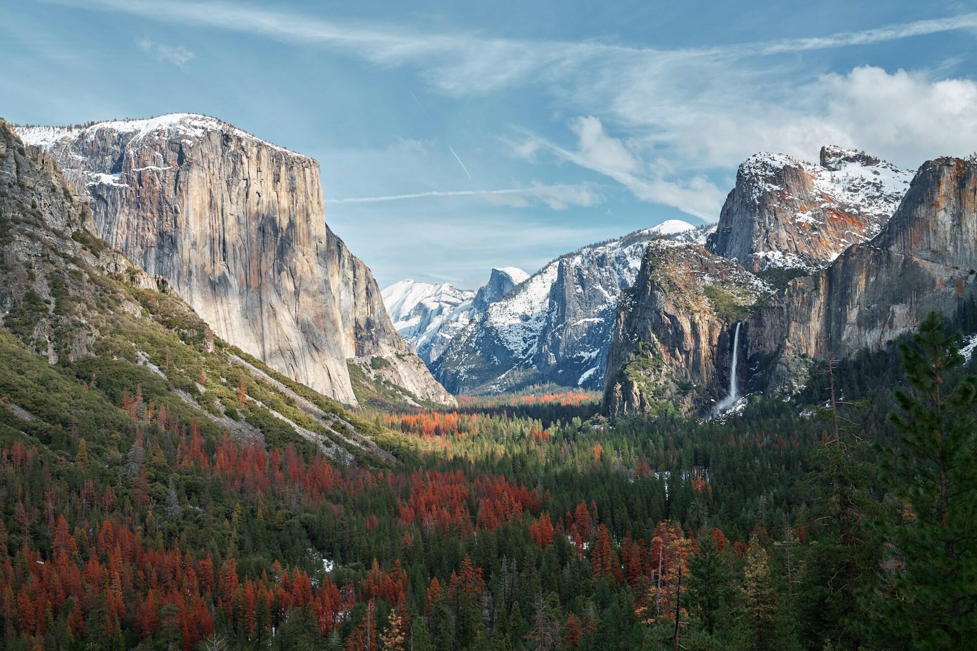 view down the Yosemite Valley with towering cliffs on either side
