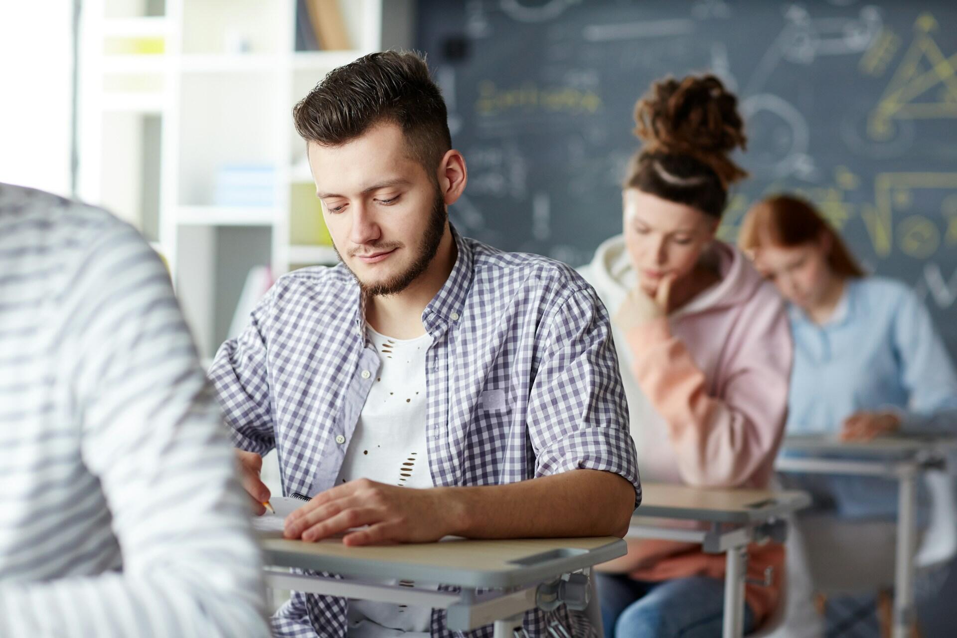students in a classroom taking a test