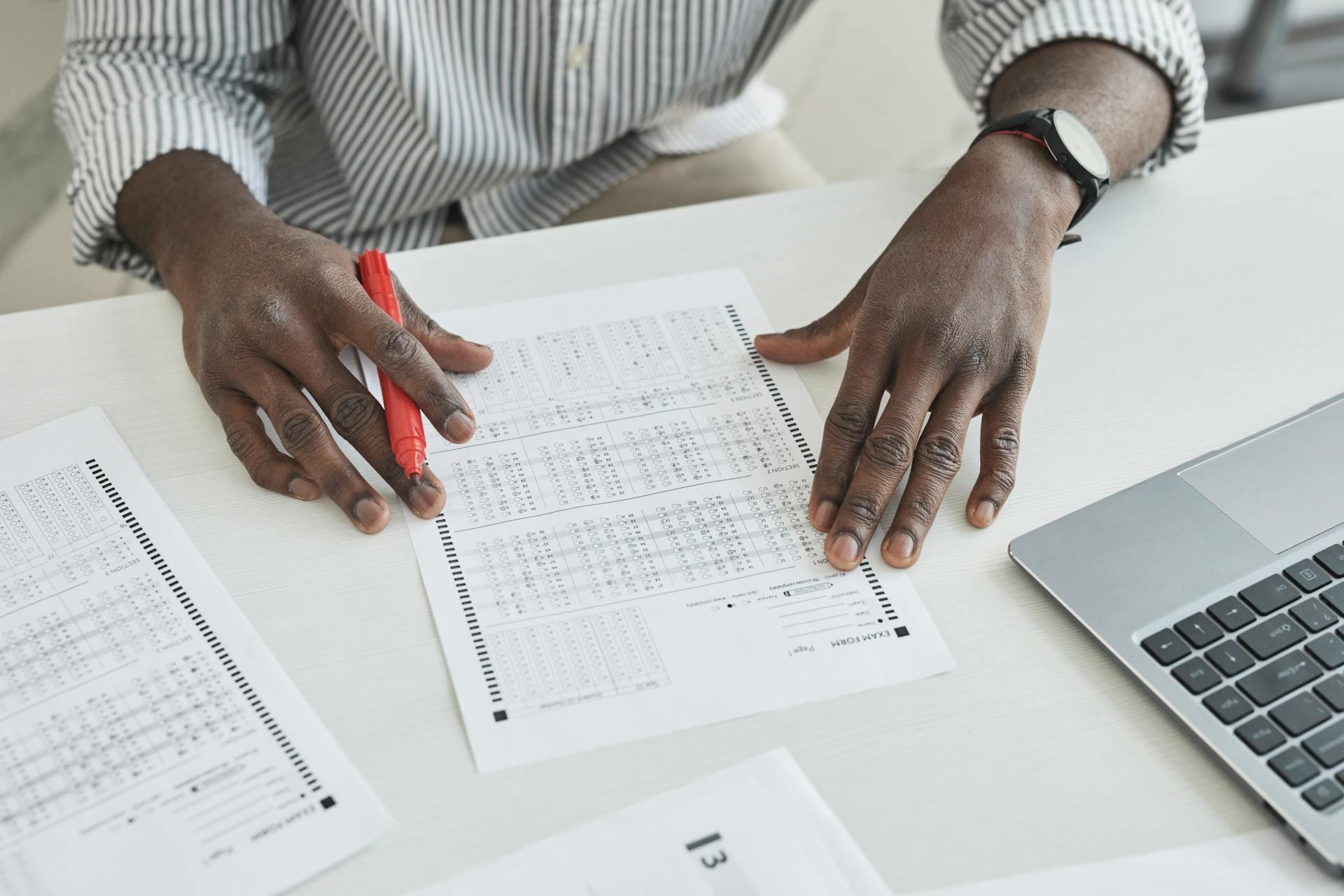 person reviewing a practice ACT test answer sheet