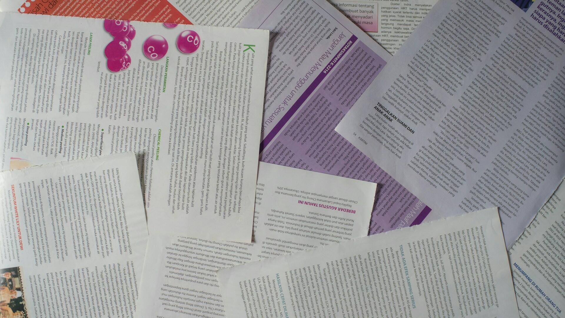 Thesis papers laid out in a pile.