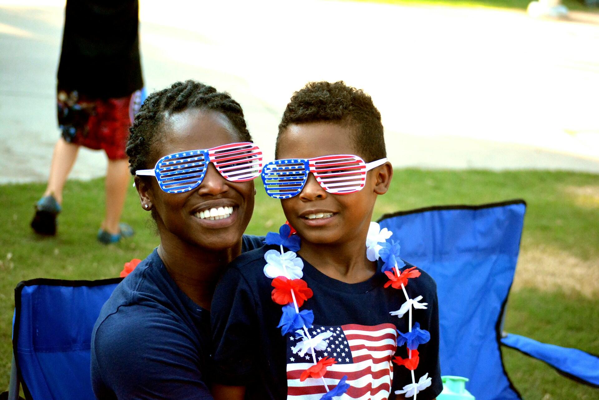 Family picnic in the park on the Fourth of July with red white and blue decorations