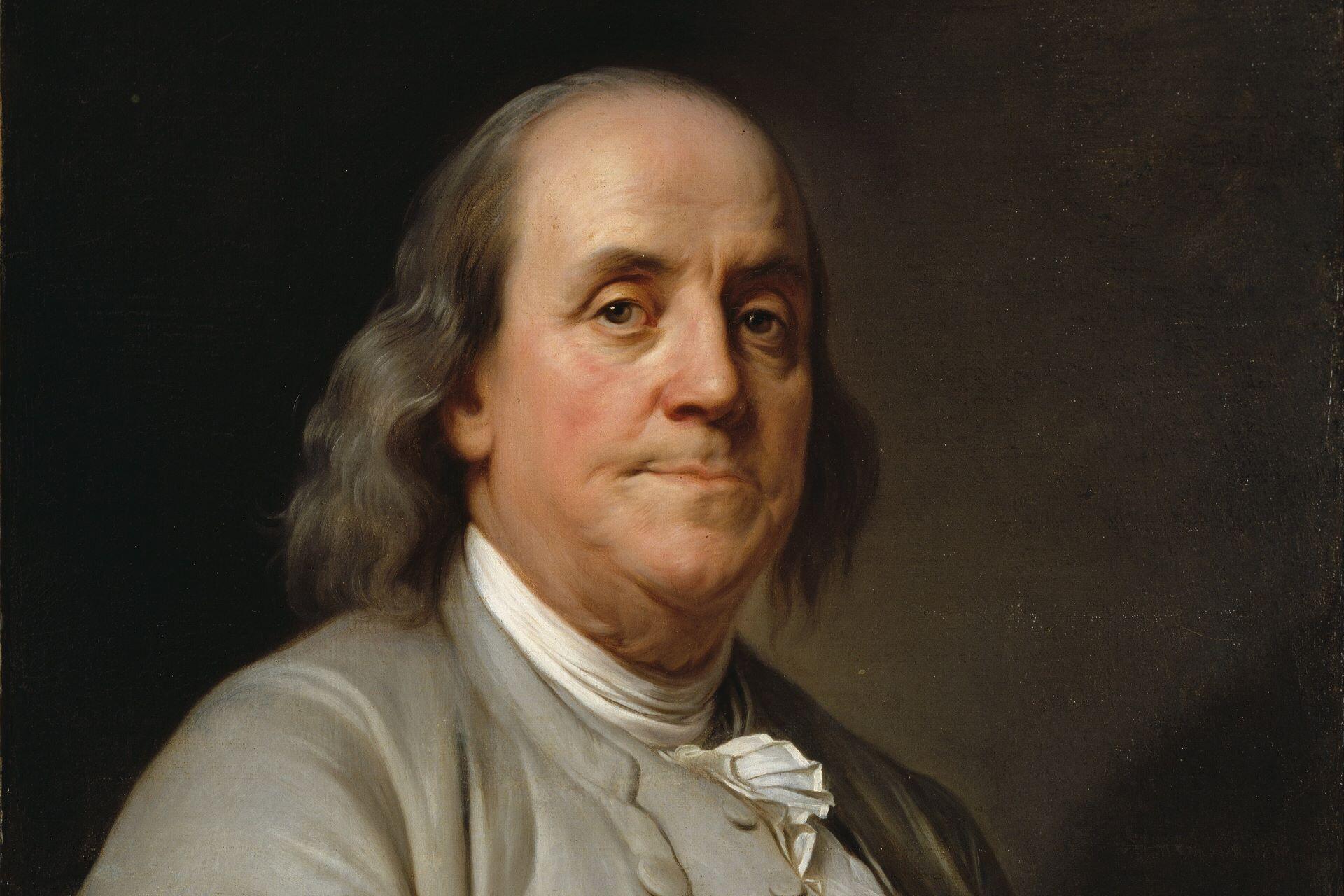 Portrait of Benjamin Franklin wearing a pale coat against a dark background.