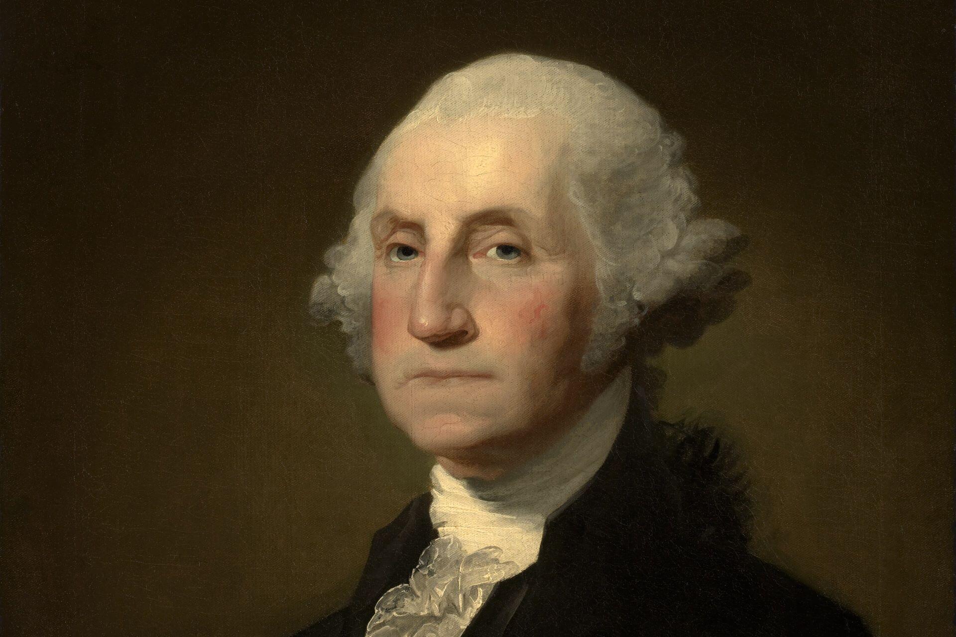 Portrait of George Washington wearing a dark coat and white cravat.