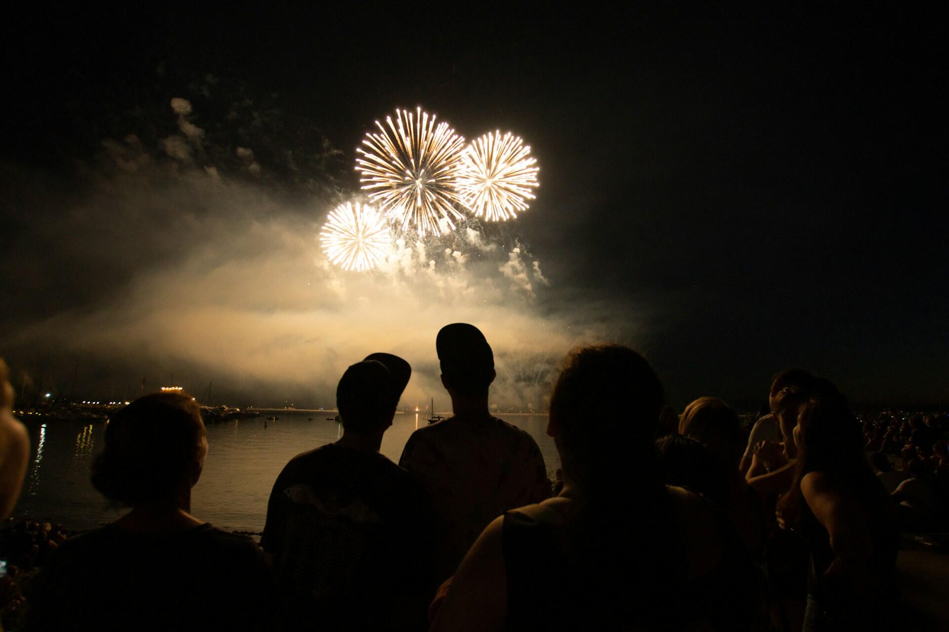 Family watching fireworks display on the 4th of July