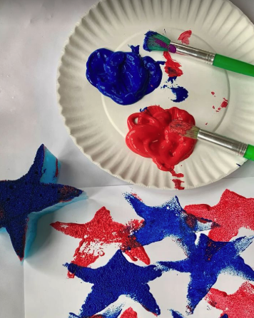 card with stars in red, white and blue, with sponge and red and blue paint