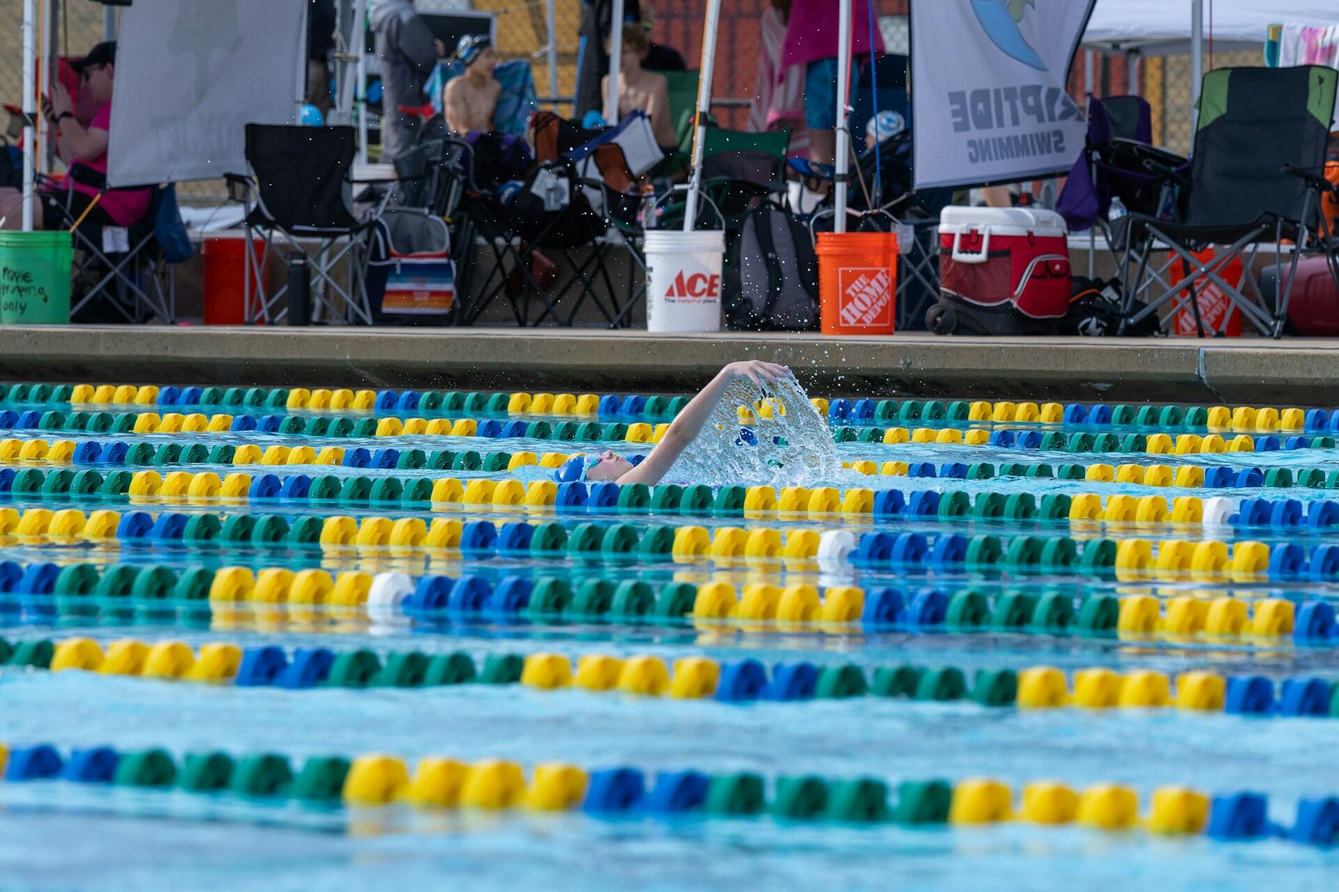 Girl swimming backstroke