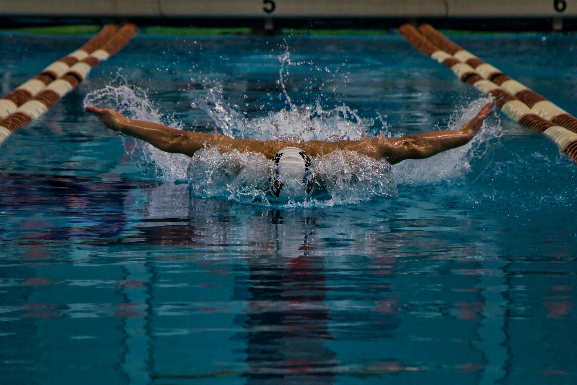 Male swimmer doing butterfly stroke