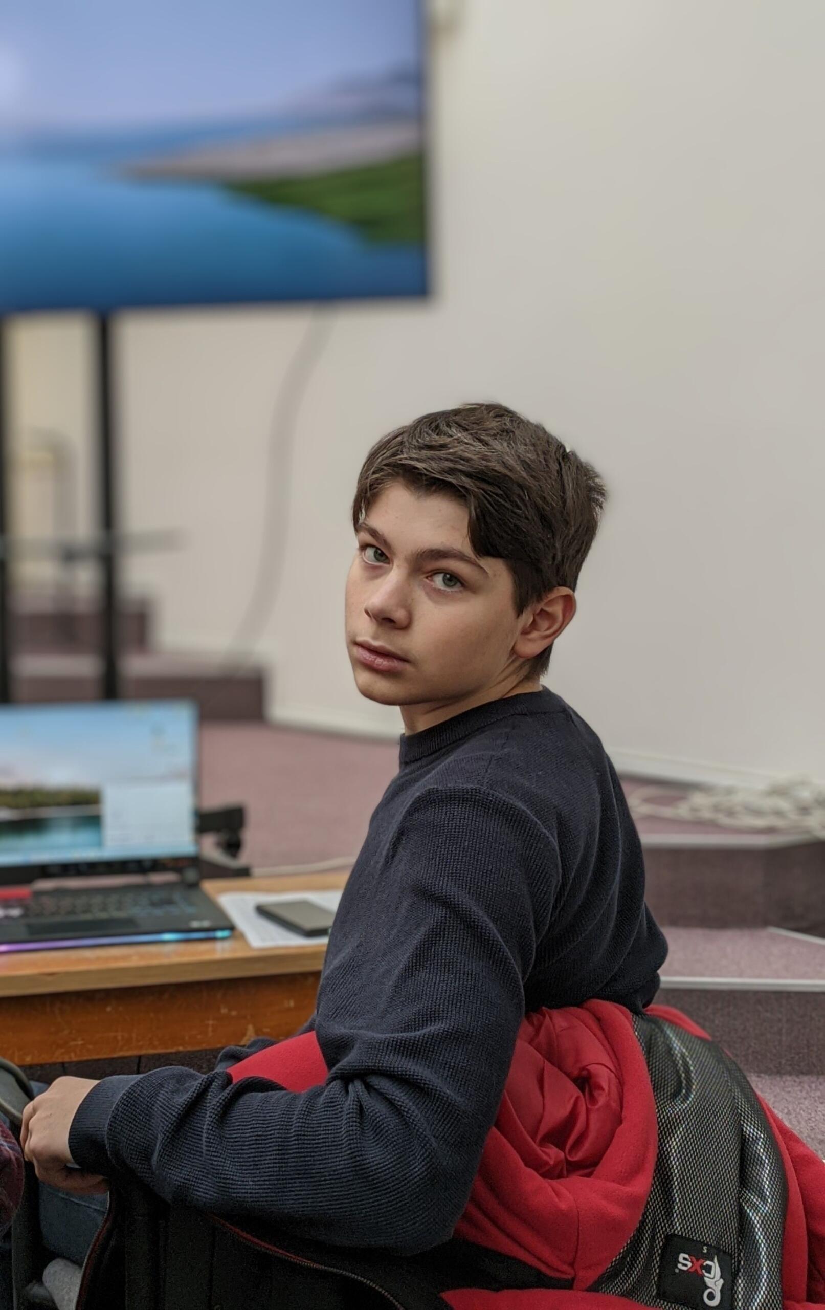 A student looking confident with the bulk of his exam preparation behind him