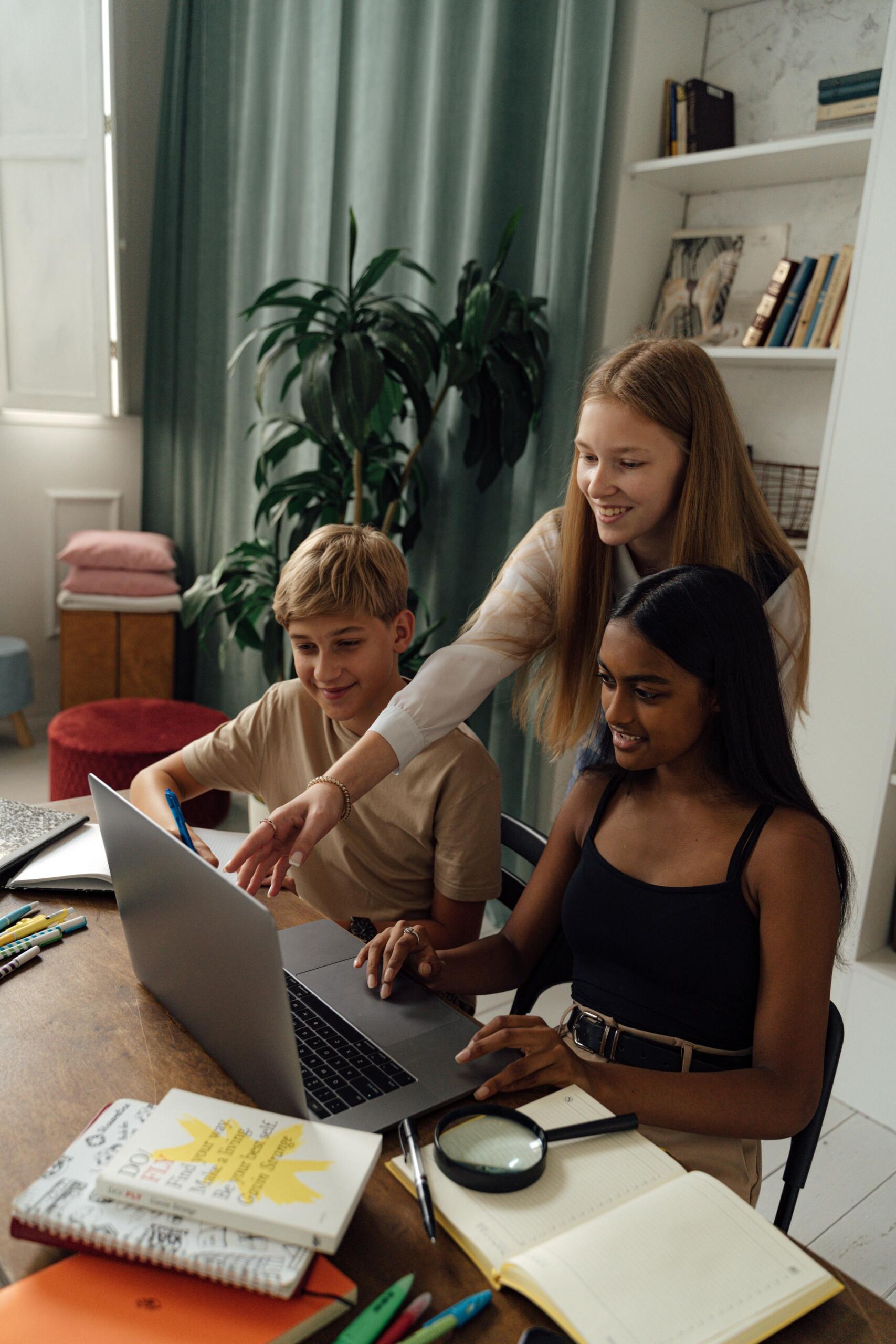 Two SAT students are working alongside a tutor.