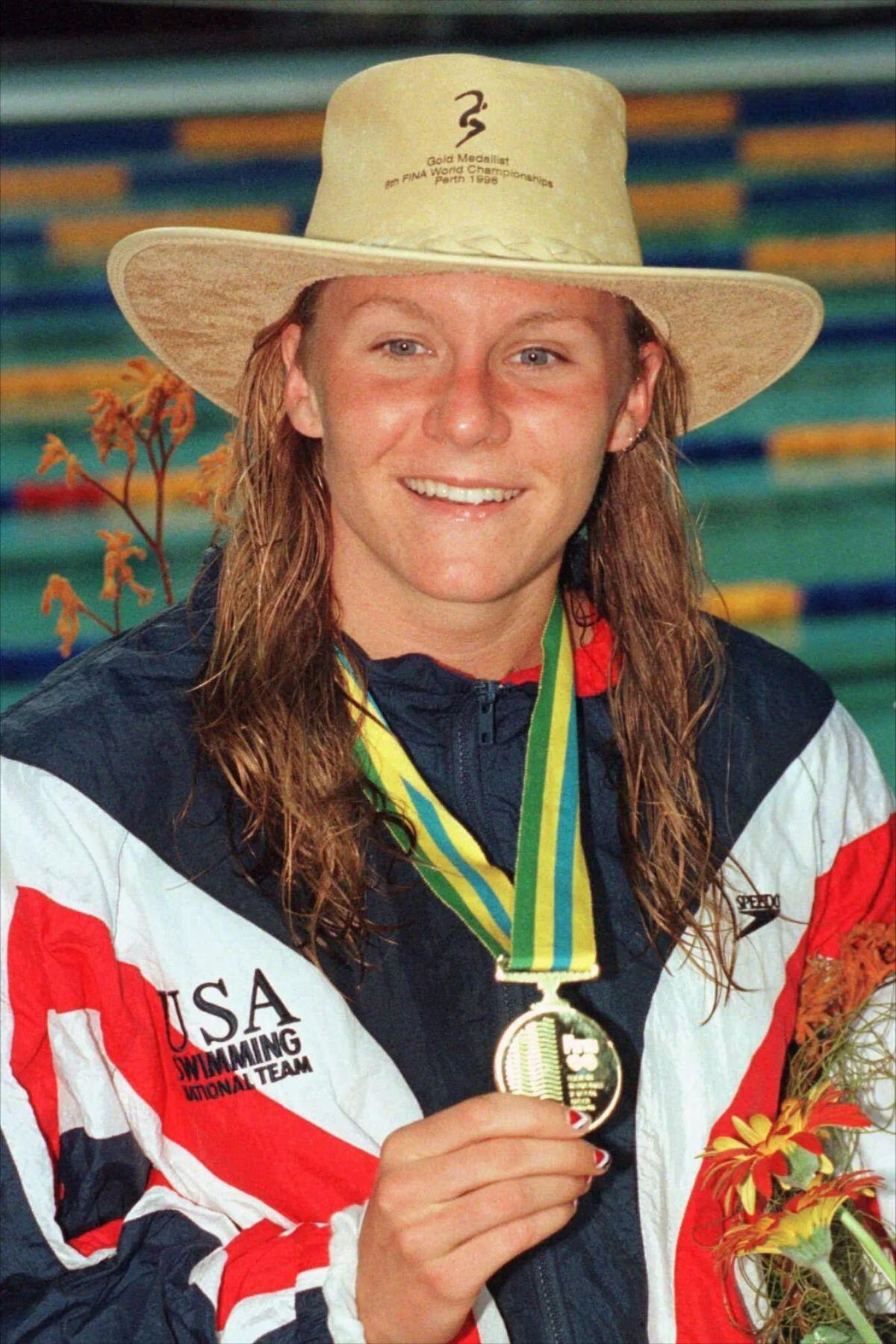 Jenny Thompson with Olympic medal