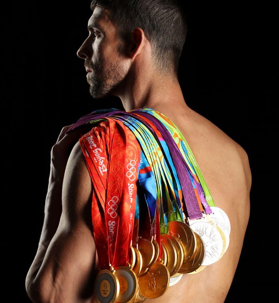 Michael Phelps with Olympic medals