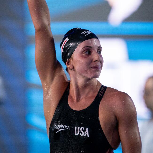 Regan Smith with her arm up