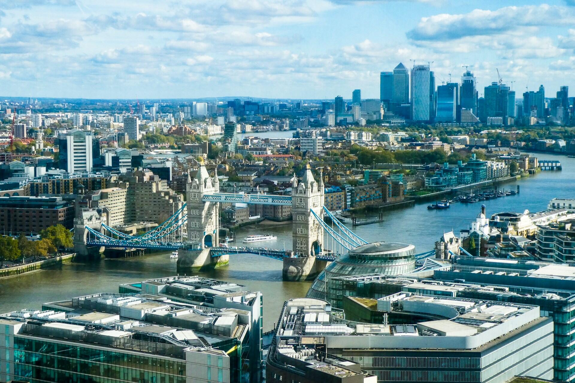 Aerial view of Tower Bridge over the River Thames with London buildings