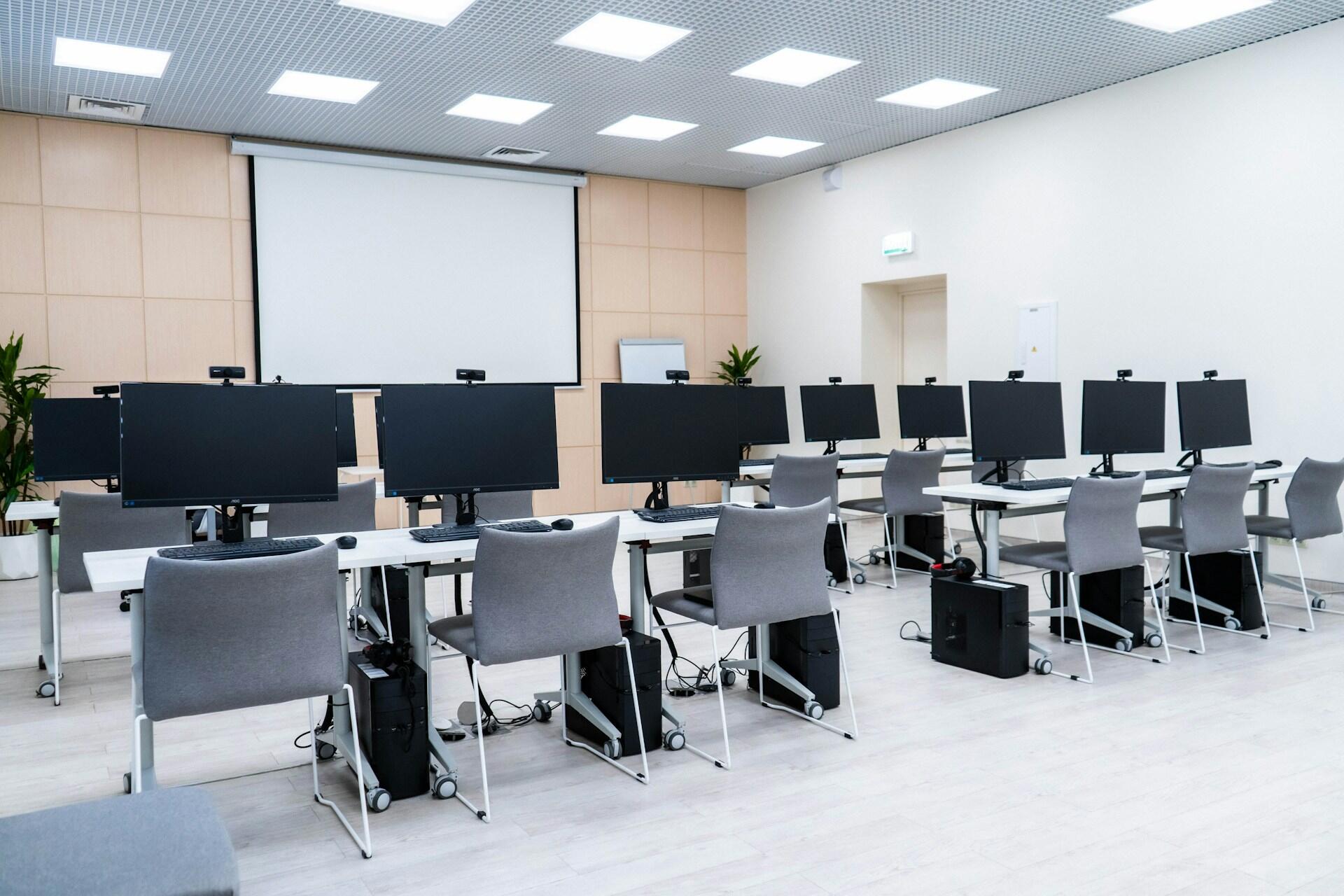 empty room filled with tidy rows of computers