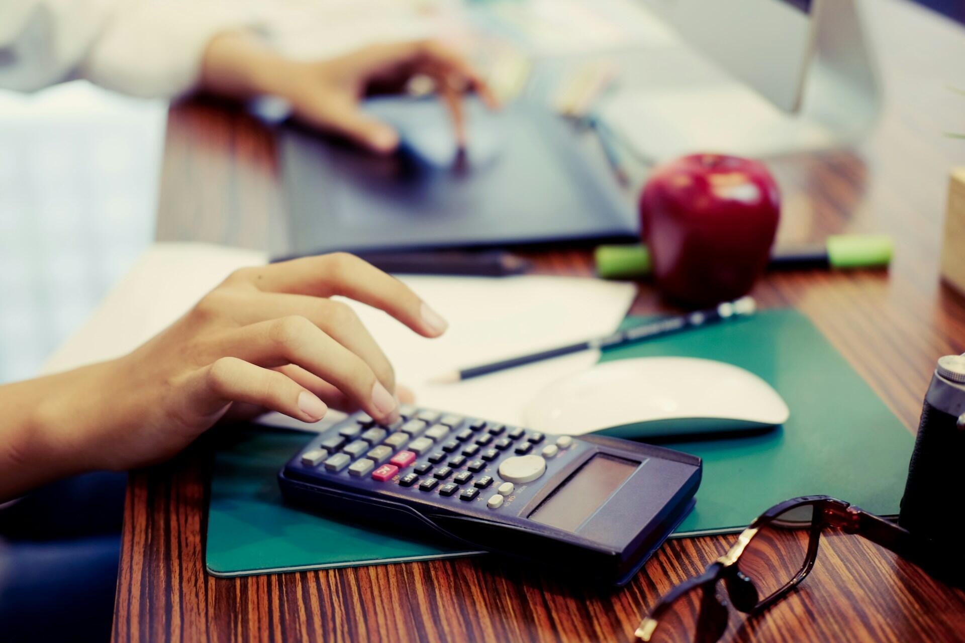 student using calculator for practice questions