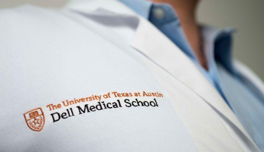 the university of texas at austin dell medical school logo engraved in a medical robe