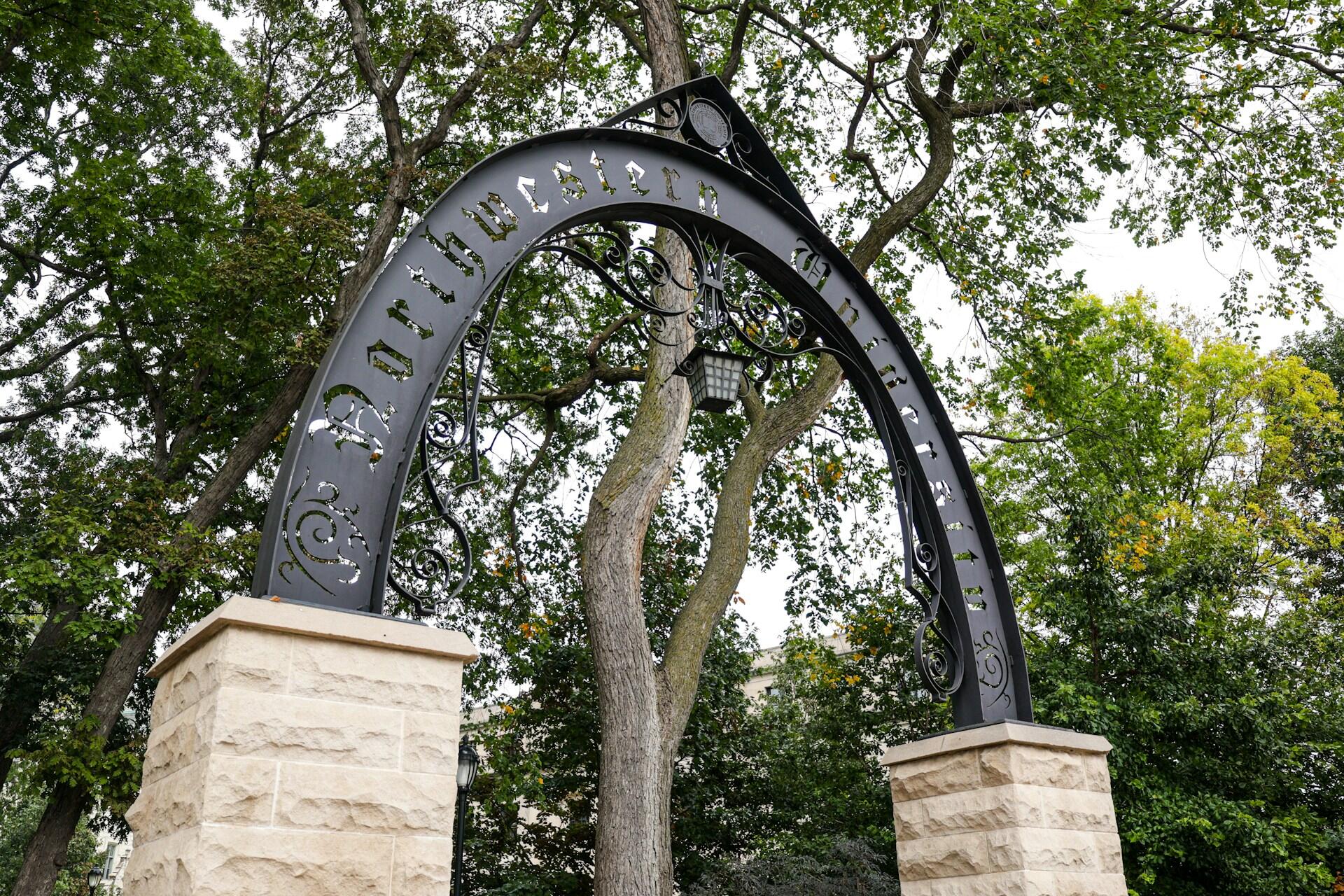 northwester university metal arch in the campus garden