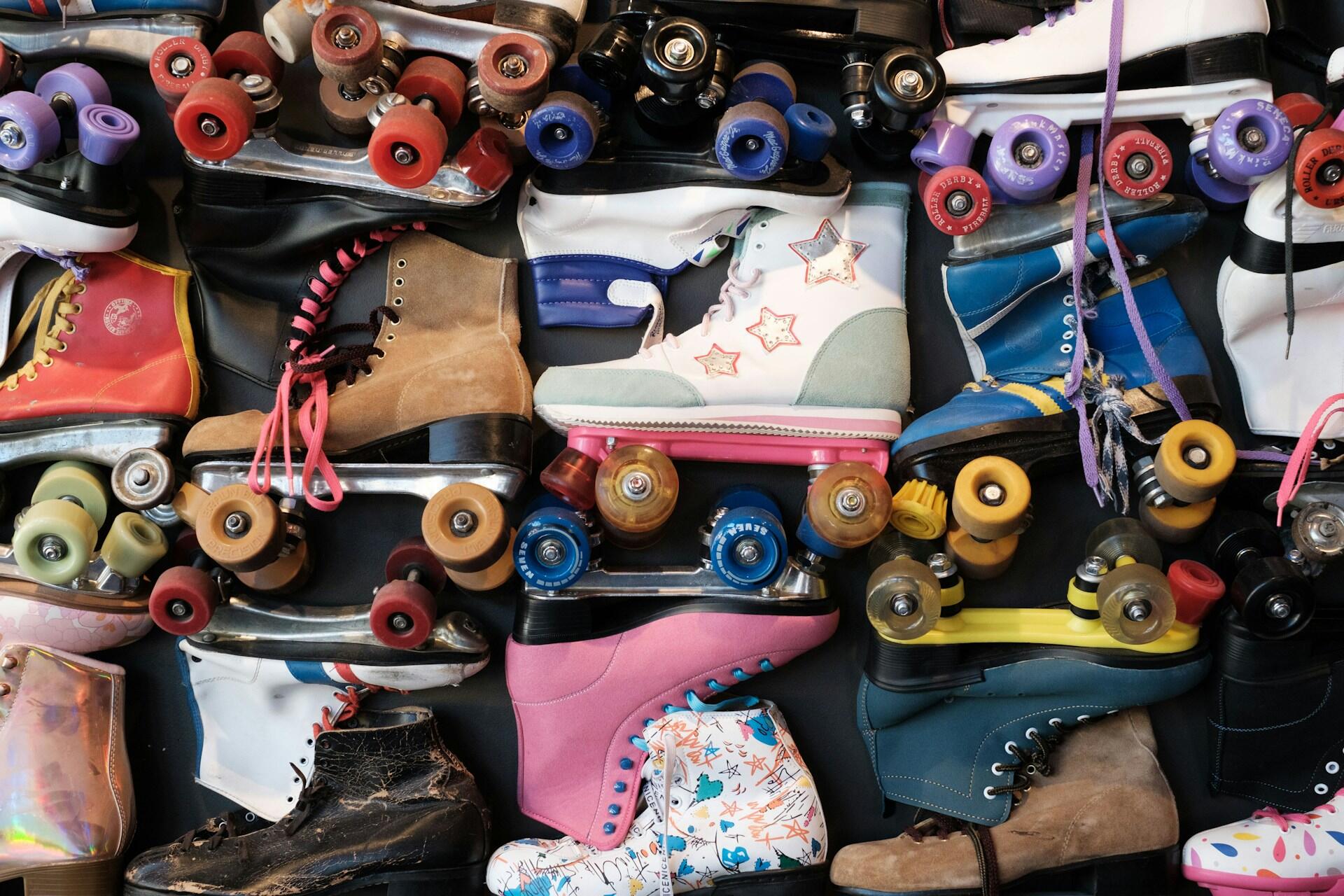 Assorted colorful roller skates arranged together