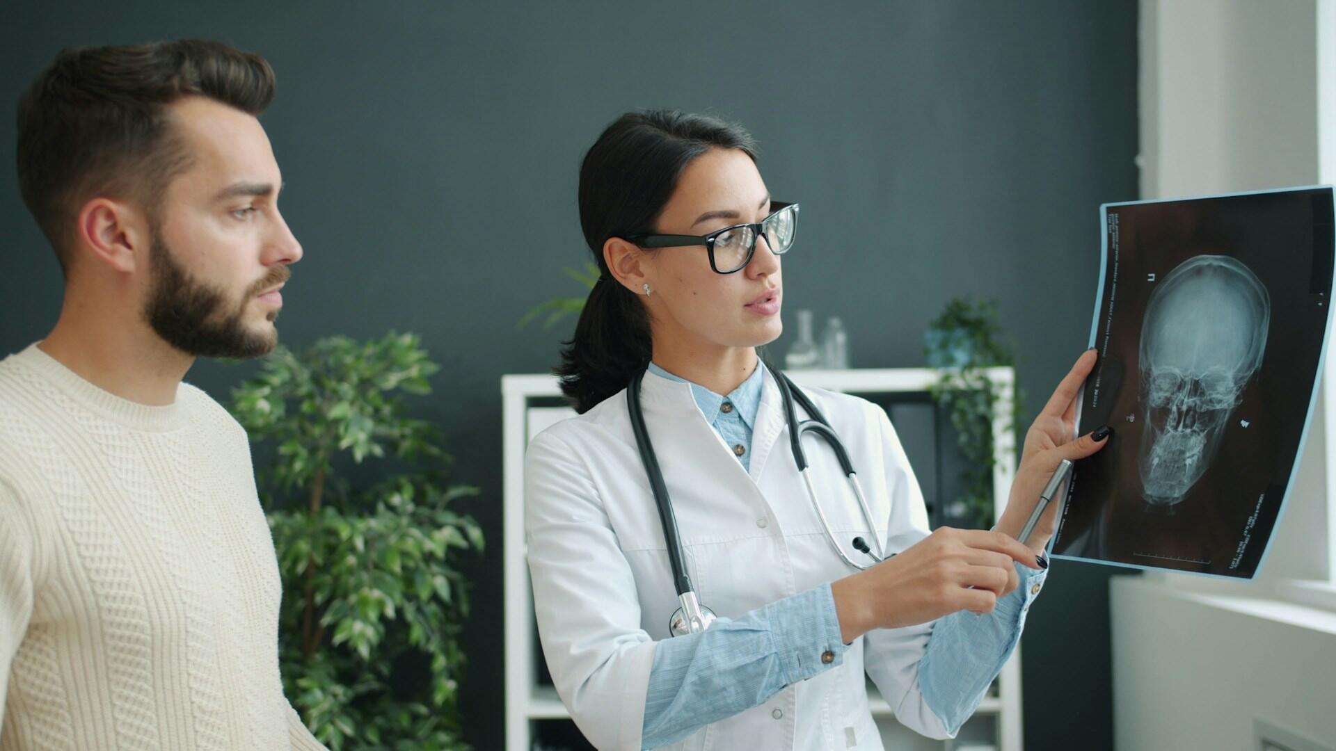 a Doctor explaining an x-ray to a patient in their office