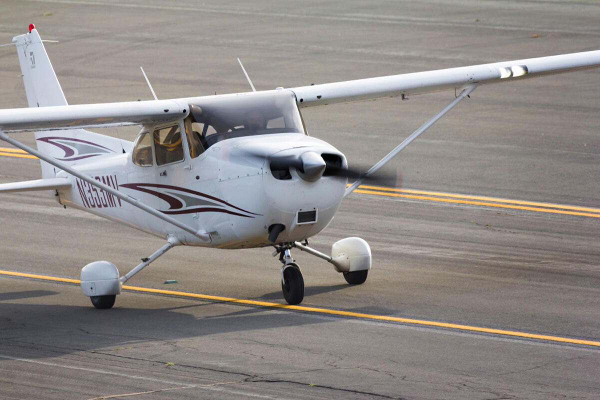 Small White Airplane Taking Off