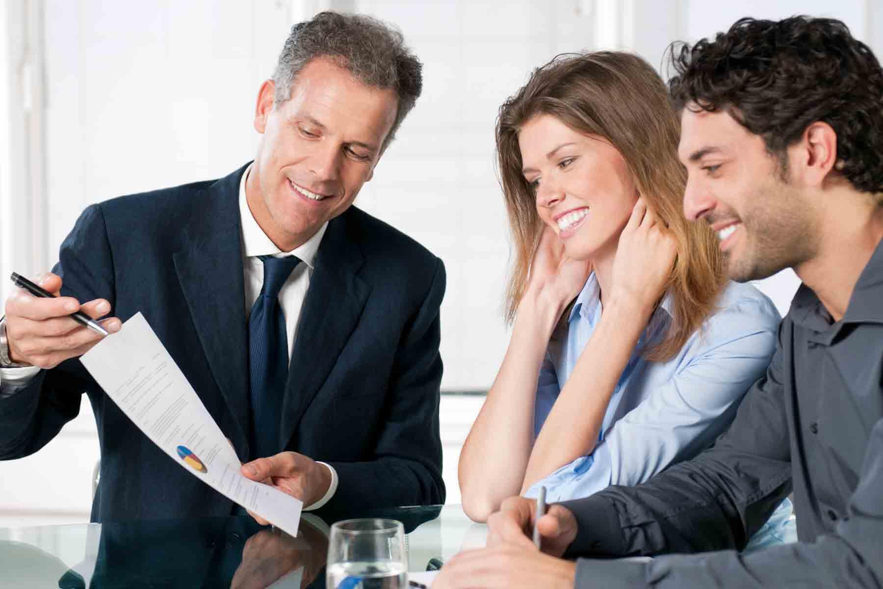 A financial advisor explaining an investment plan to a young couple