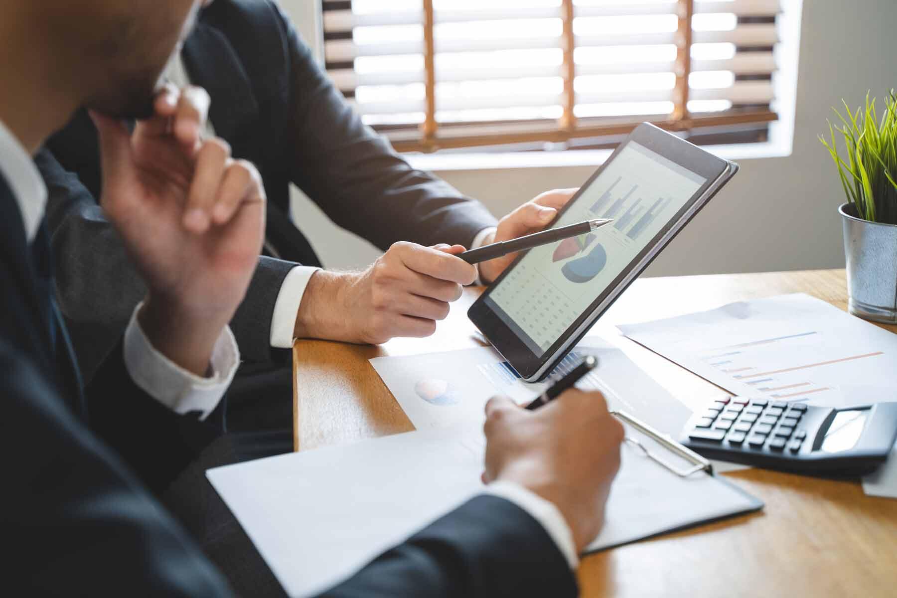 A financial advisor showing a client their investment portfolio results
