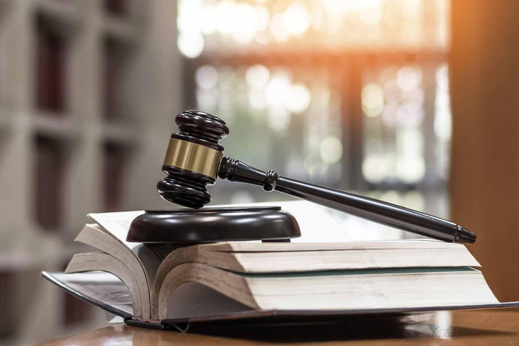 A judge's gavel resting on top of law books