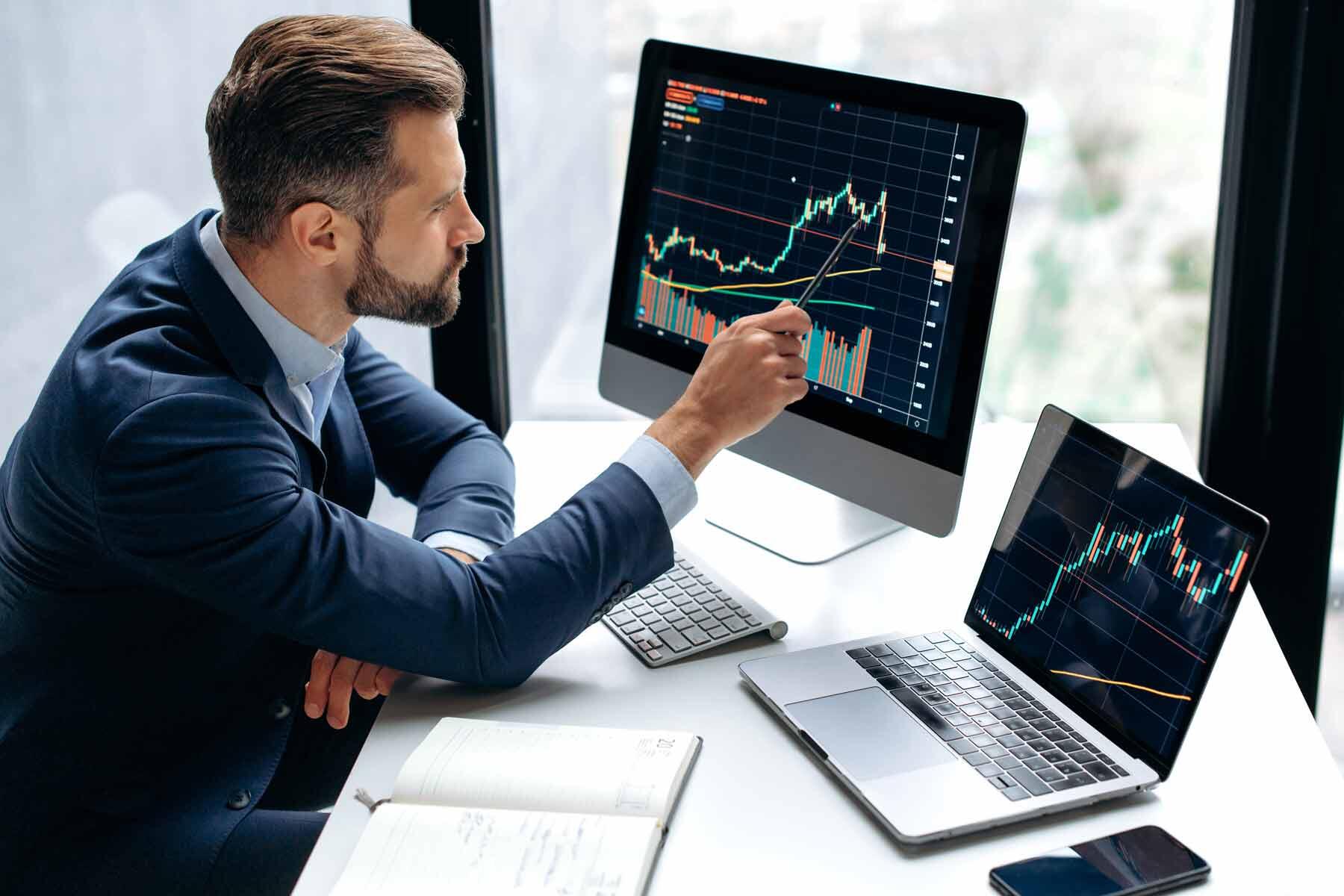 A man studying for a finance and investing exam