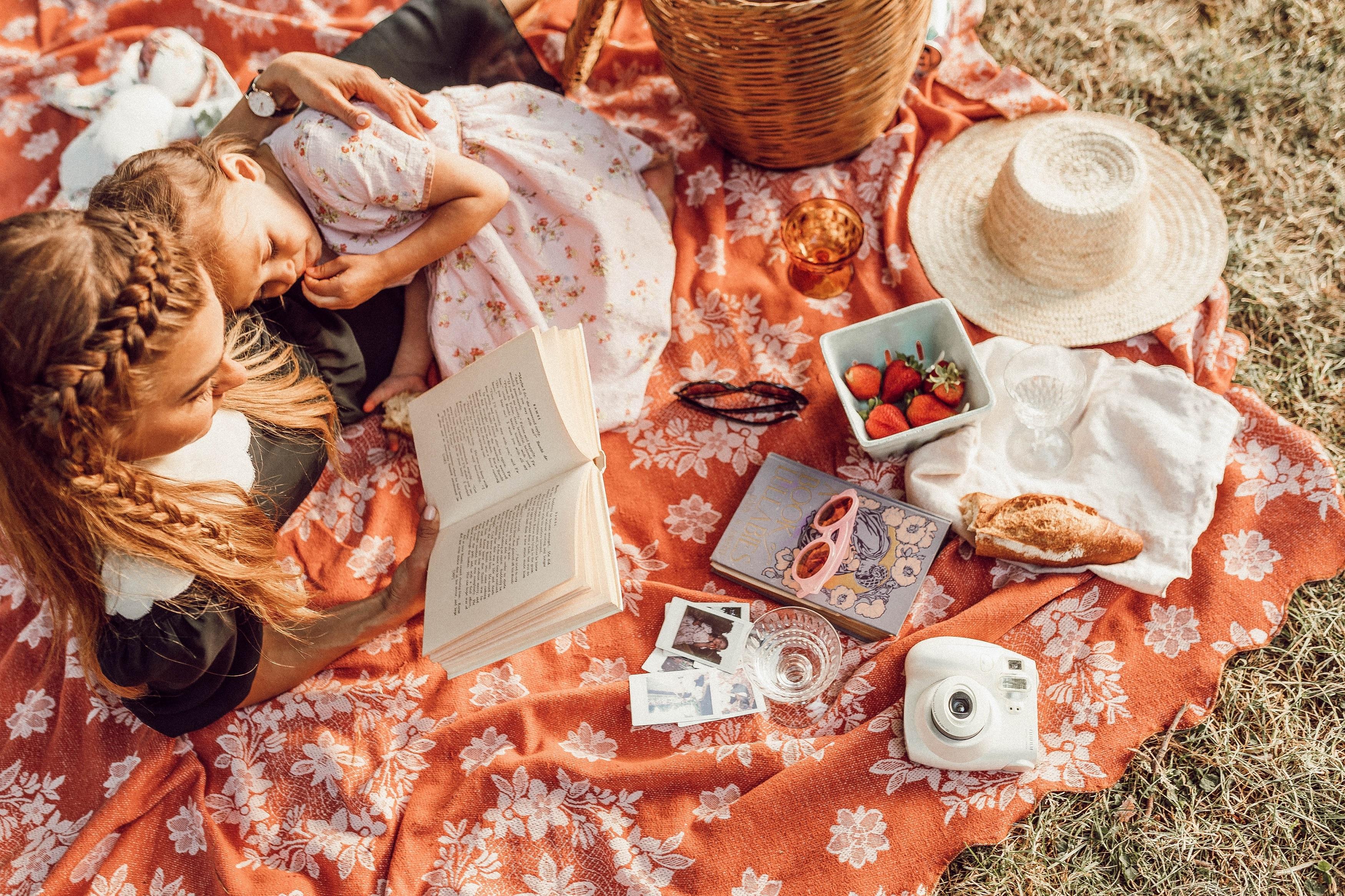 Two girls reading book