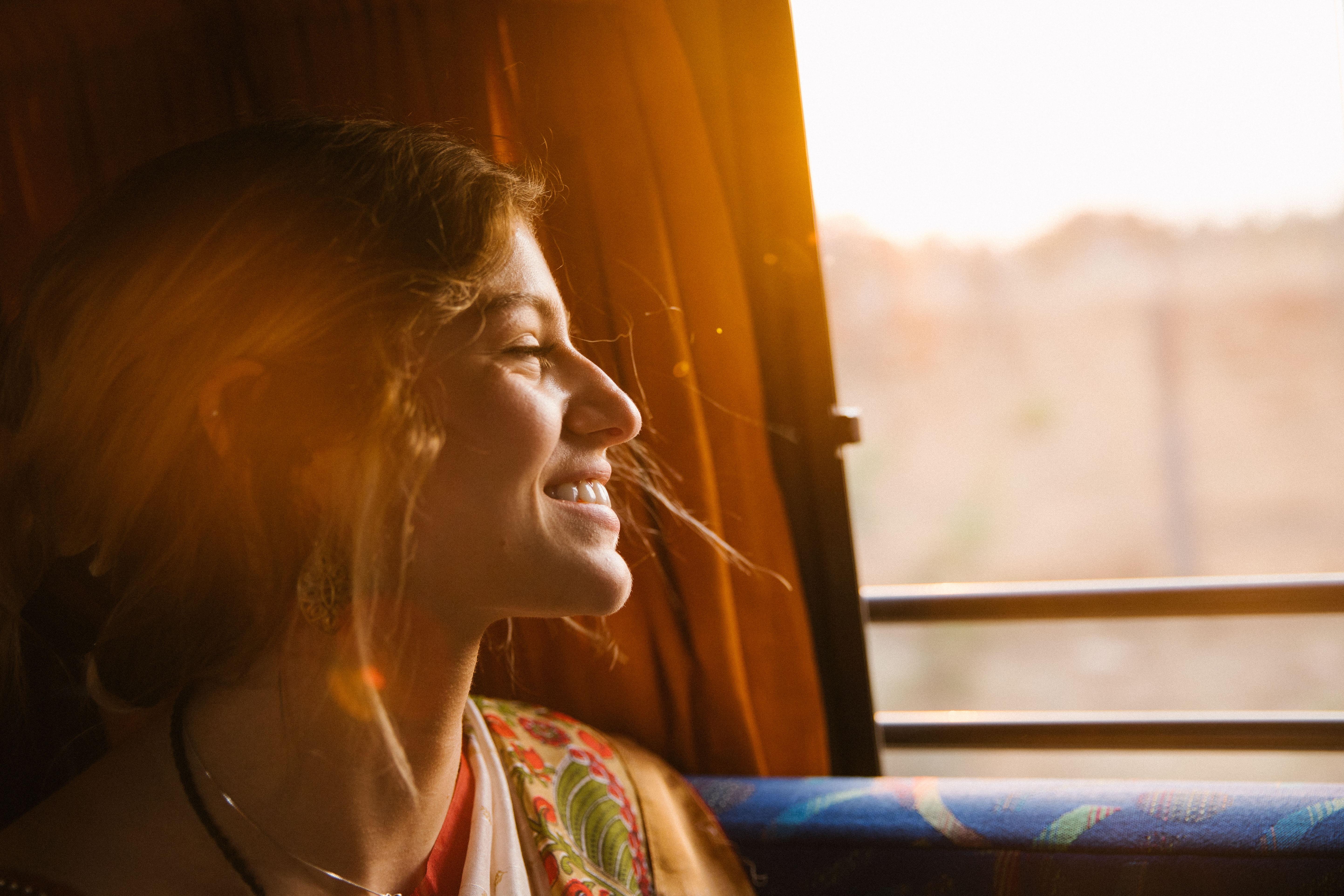 happy woman on train