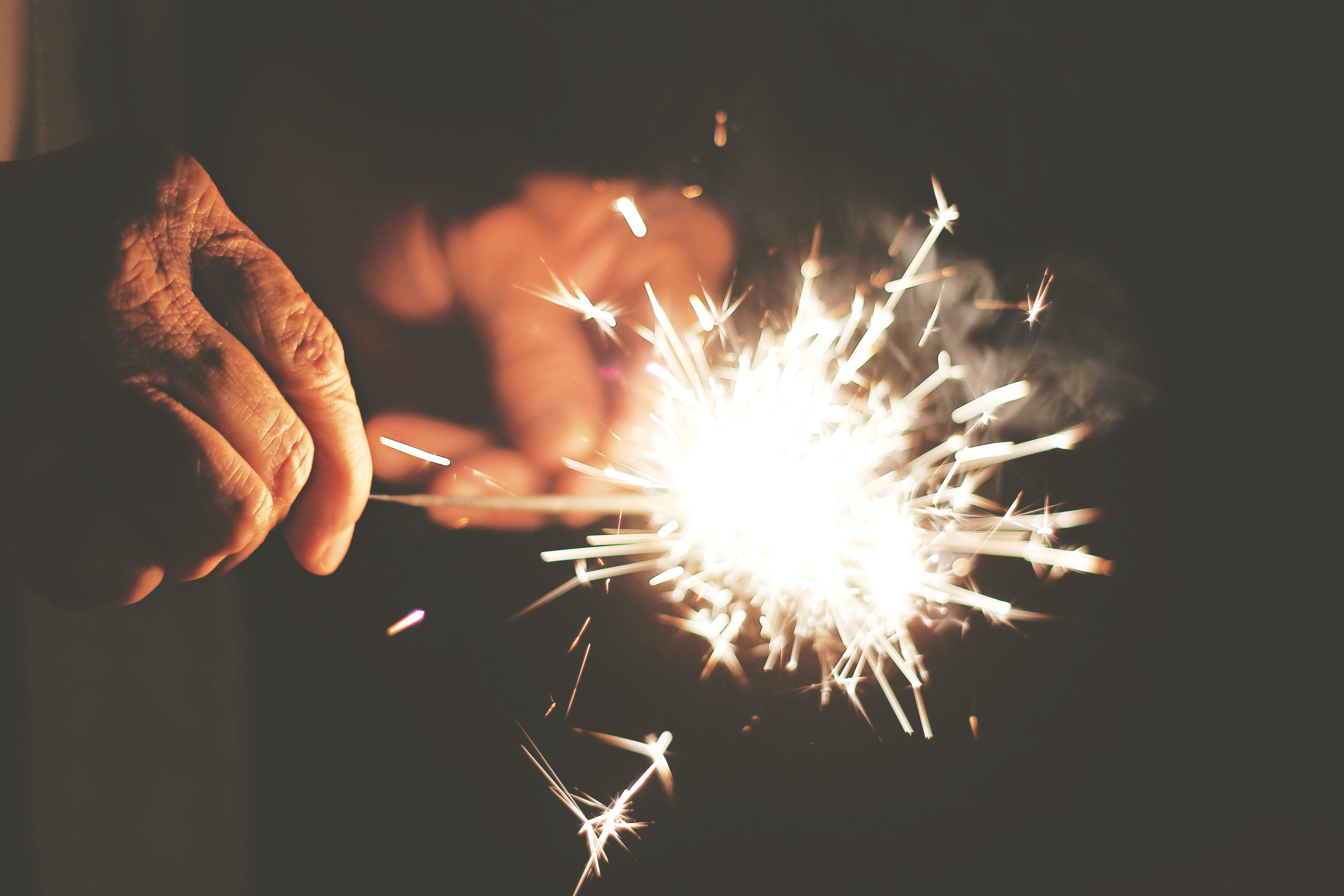 person holding sparkler