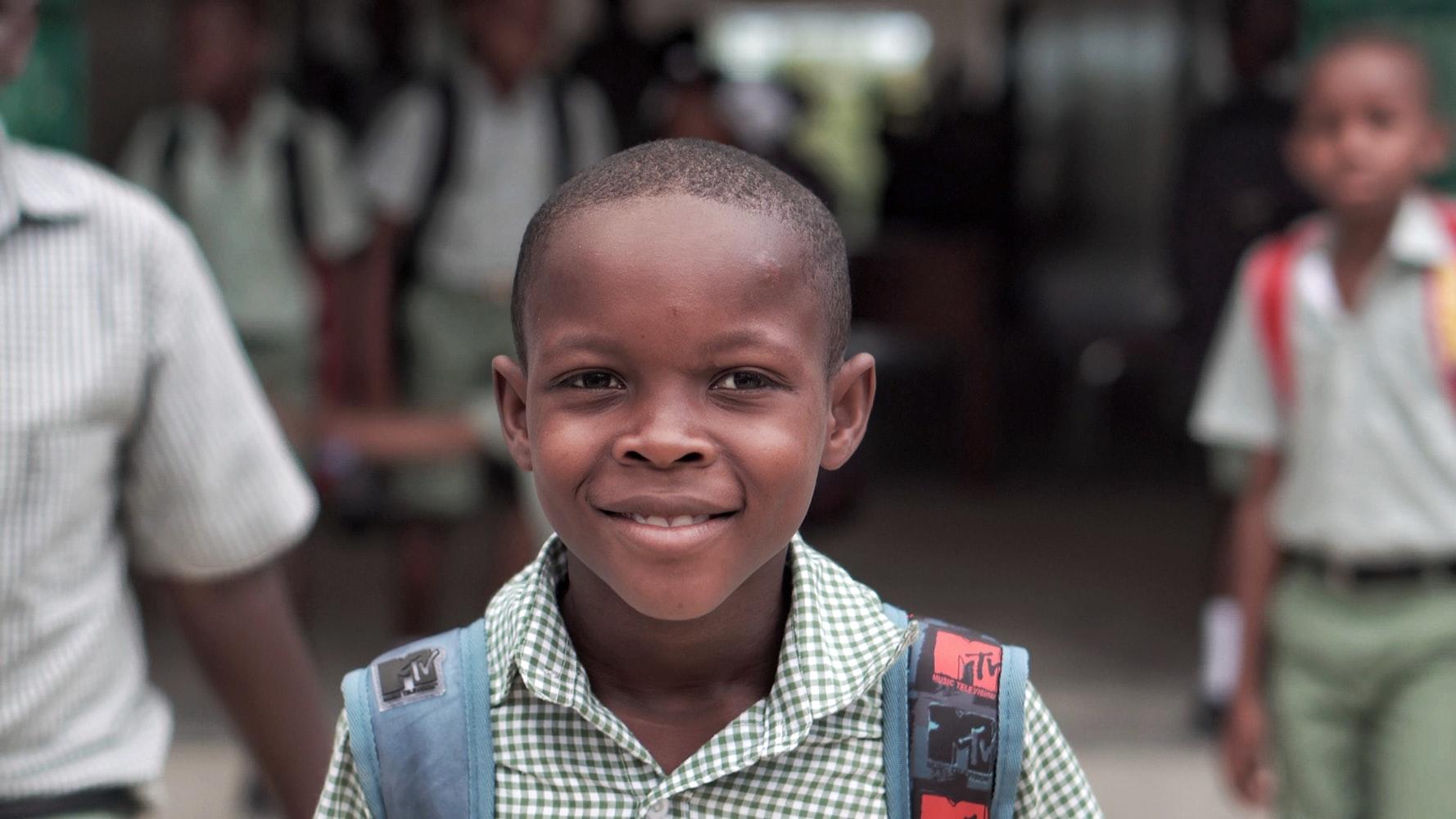 school boy wearing backpack