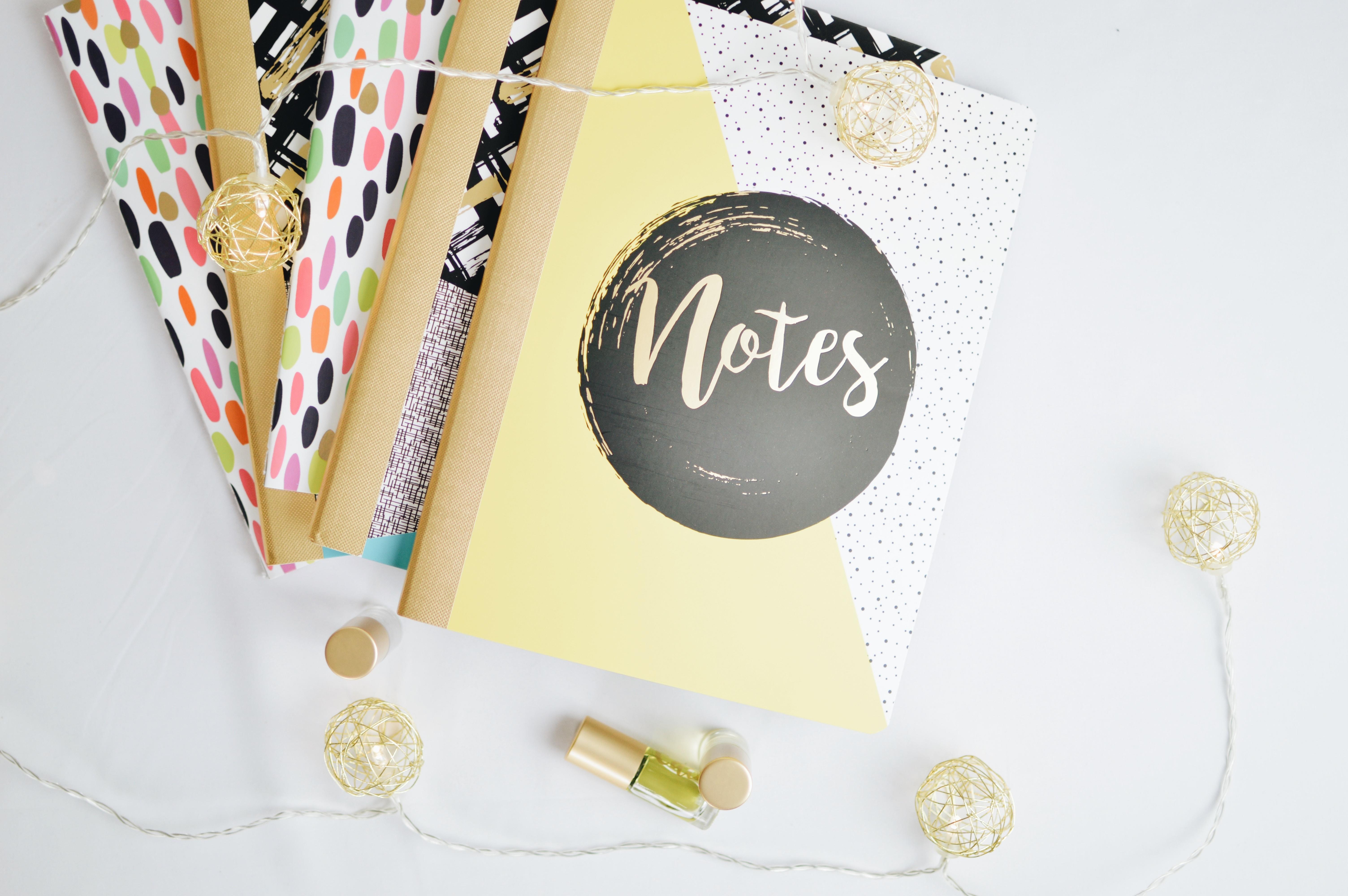 pile of notepads on desk