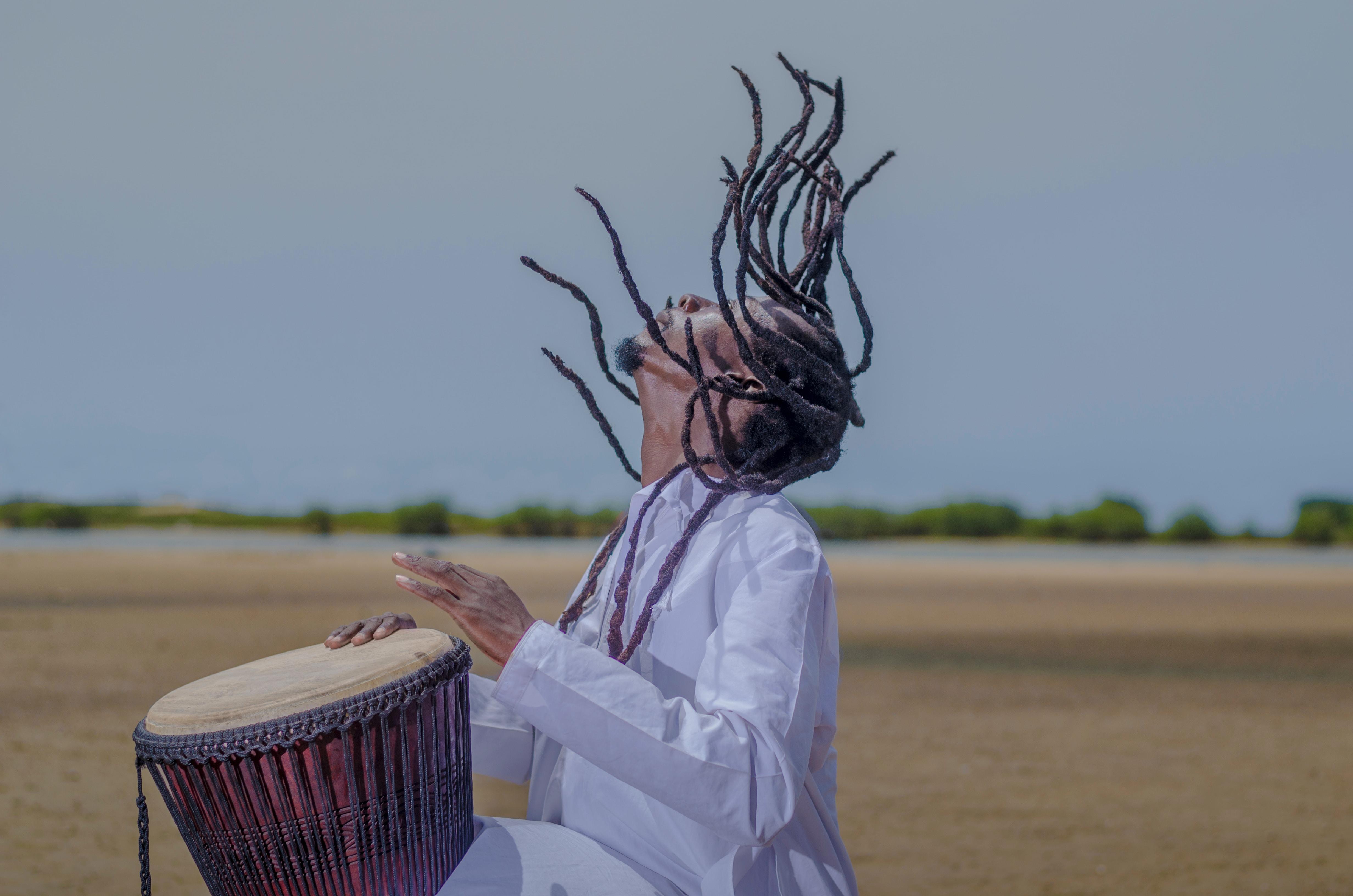 Man playing African drum