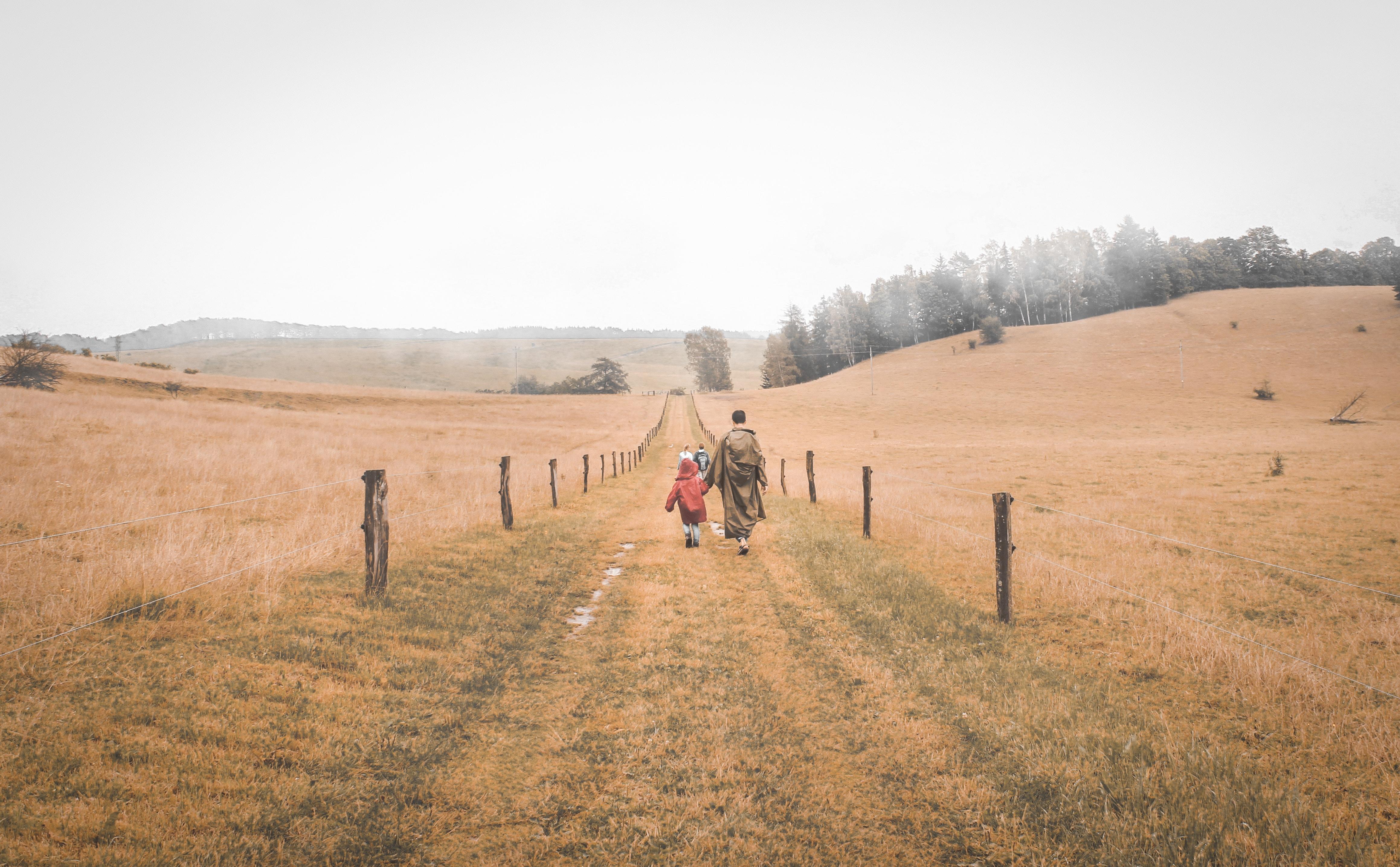 Woman and child walking on pathway