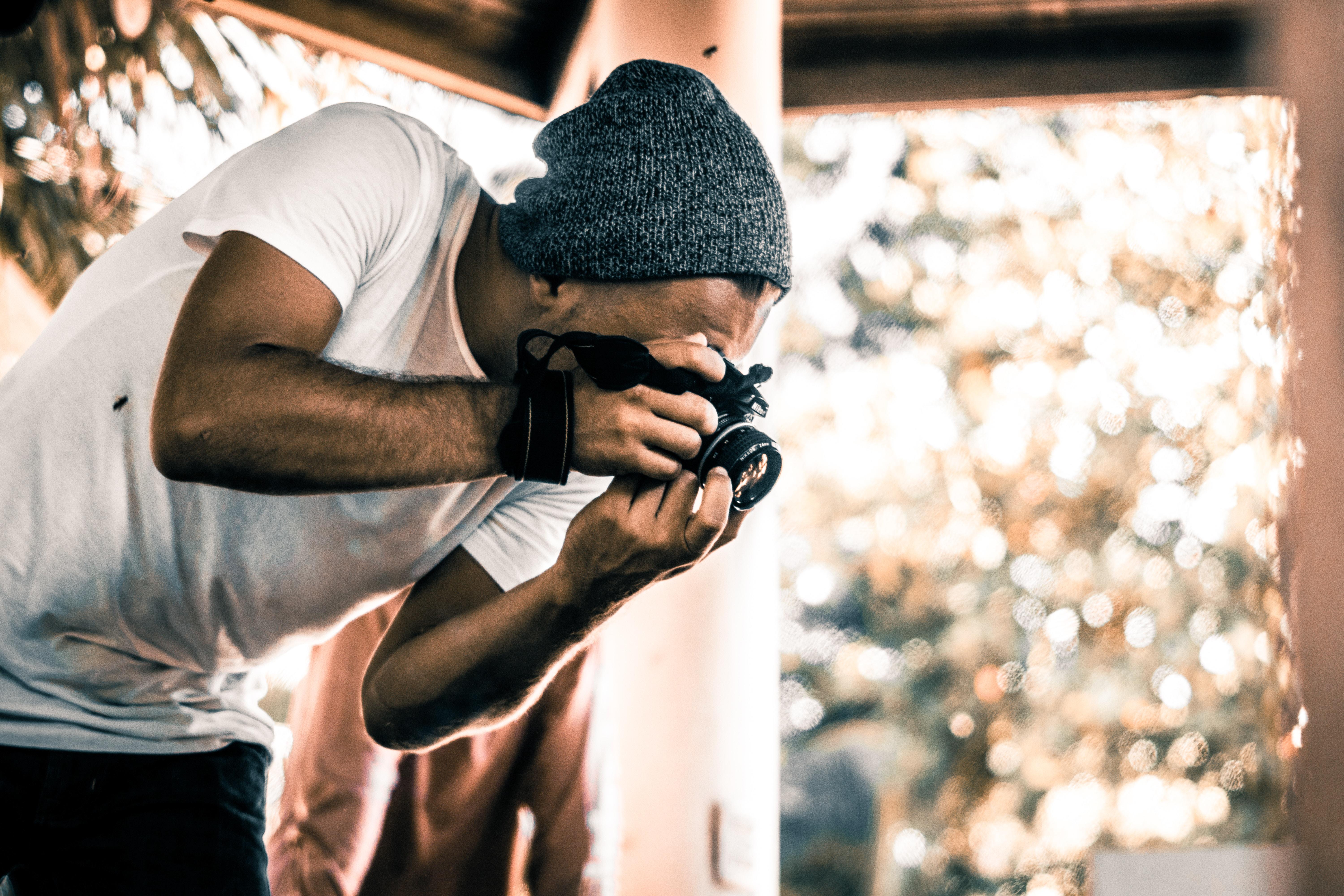 photographer taking photo indoors during daytime