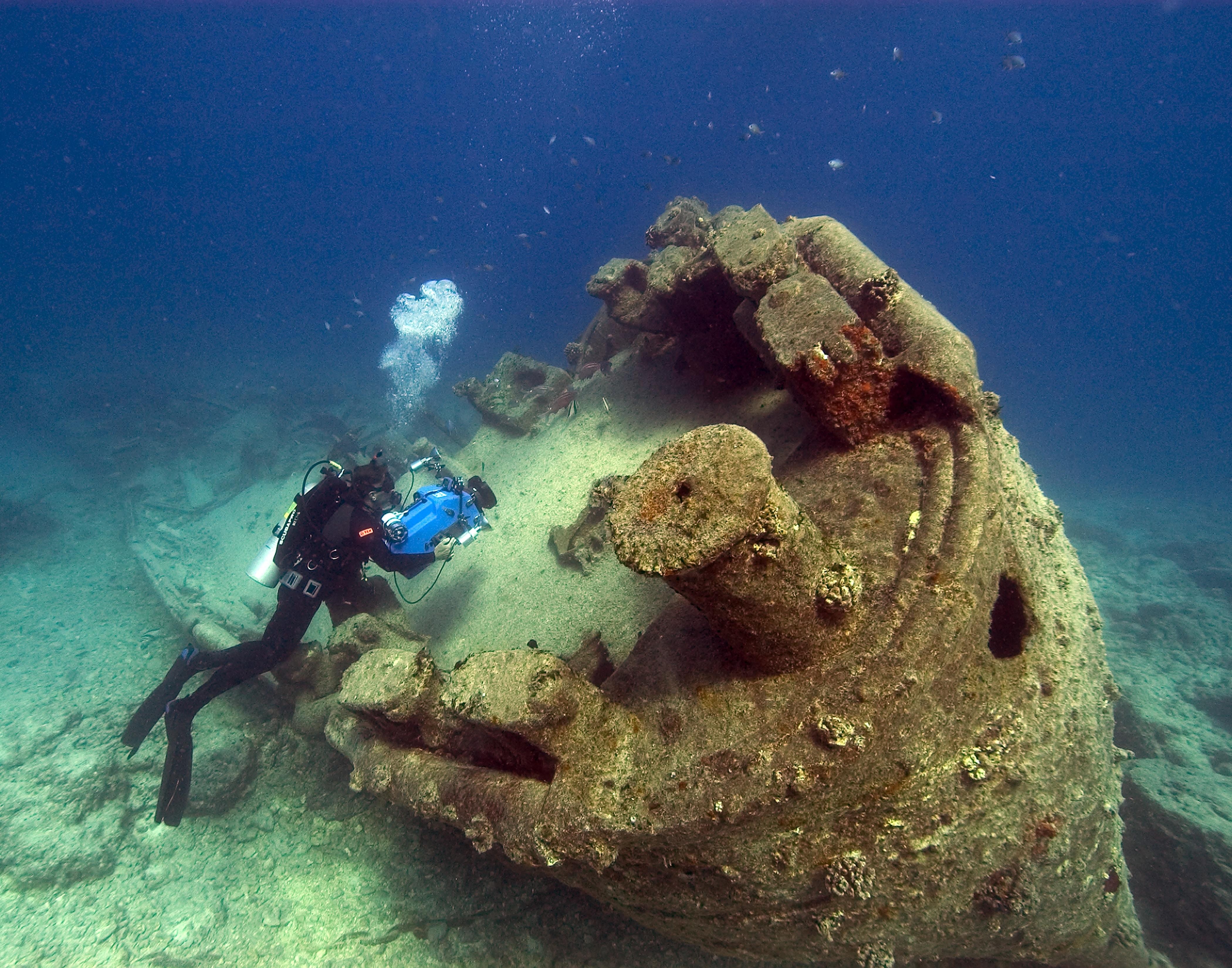 diver and underwater shipwreck