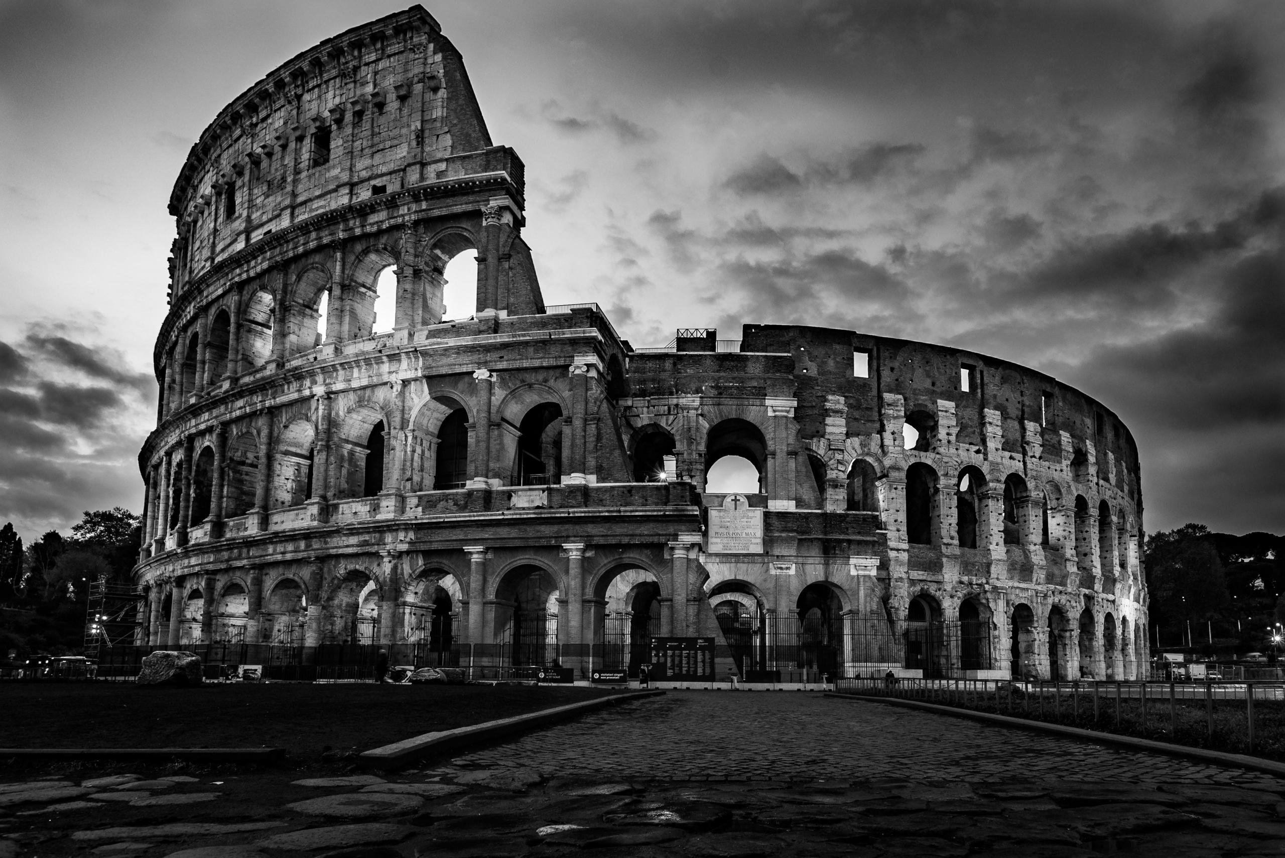 black and white photo of colosseum in rome
